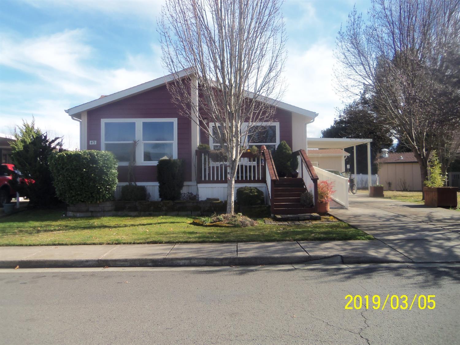Settle right into this lovely manufactured home. Offering 2B/2B with a study, could be 3rd bedroom, 1458sq f. This home has many extras and it shows as soon as you enter. Meticulously maintained. Built in 2005, open floor plan, lovely kitchen with lots of space and eating bar. Lots of windows for natural light. Spacious master bedroom & master bath with double sinks. Solar tube also. Relax on the small wood deck just off the master bedroom with privacy. Great curb appeal with carport and custom built storage shed. Extra wide cement for parking area and overhang cover for carport. Many extras with hardi lap exterior siding & handi cap friendly access. Very nice location next to the Recreation Center and bike path. Park amenities. Includes all appliances. A must tour and very easy to show.