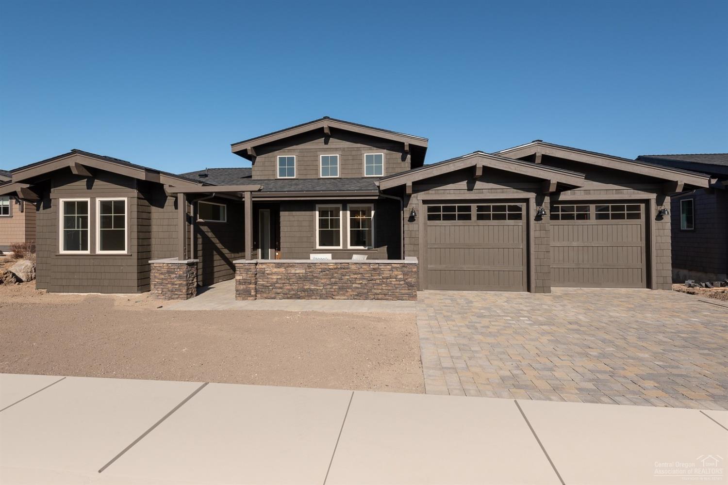 This stunning premium view lot with Cascade Mountain and golf course views is conveniently located on The Rim near the Tetherow clubhouse, fitness center, pool and three restaurants. Main floor master suite with fabulous bath and private covered balcony; gourmet kitchen opens to impressive great room with large covered balcony. Den plus 2 en suite bedrooms on main level; two additional en suites and bonus room on lower level. The HOA maintains the landscaping for easy carefree living. Mt Bachelor and Phil's Trail are right at your doorstep!