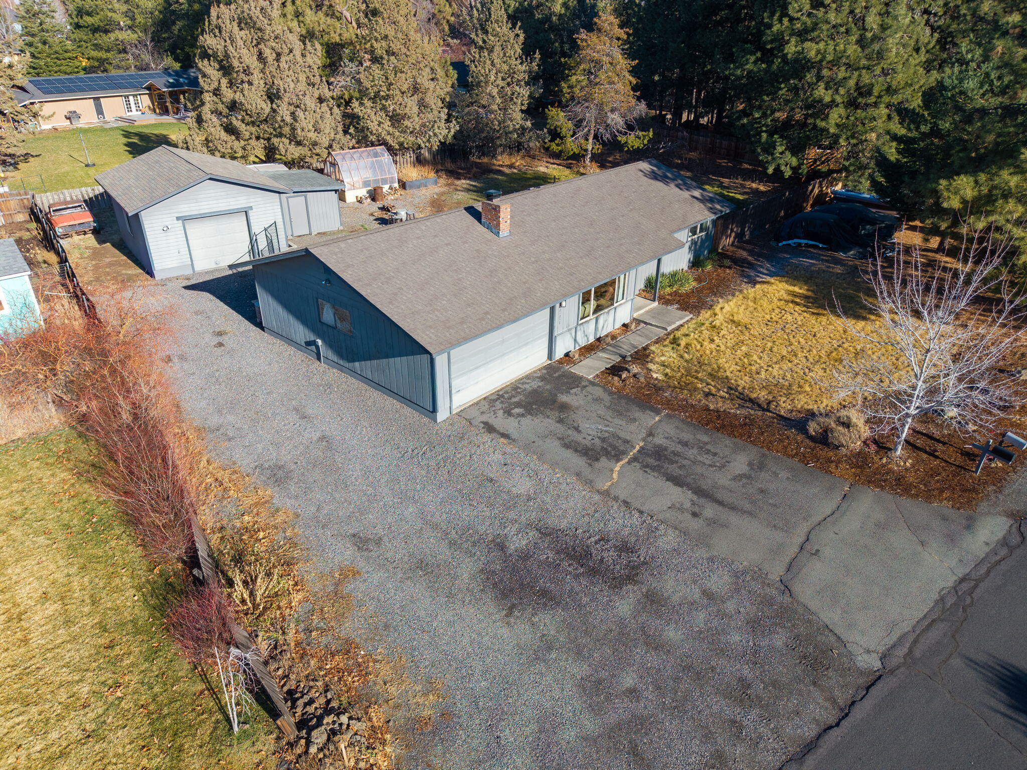 Single-level home on a spacious 0.44-acre lot within city limits, offering ample room for RV parking and recreational toys!! Tucked away on a quiet street with convenient access to shopping and medical facilities. The home features three bedrooms, two bathrooms, a comfortable living room with wood floors and a wood-burning fireplace, and a forced-air furnace with heat pump. An attached two-car garage includes a bonus area for added flexibility. The backyard boasts a 20x24 heated shop/single-car garage, a storage shed, and a hot tub. With a little TLC, this property has the potential to truly shine!!