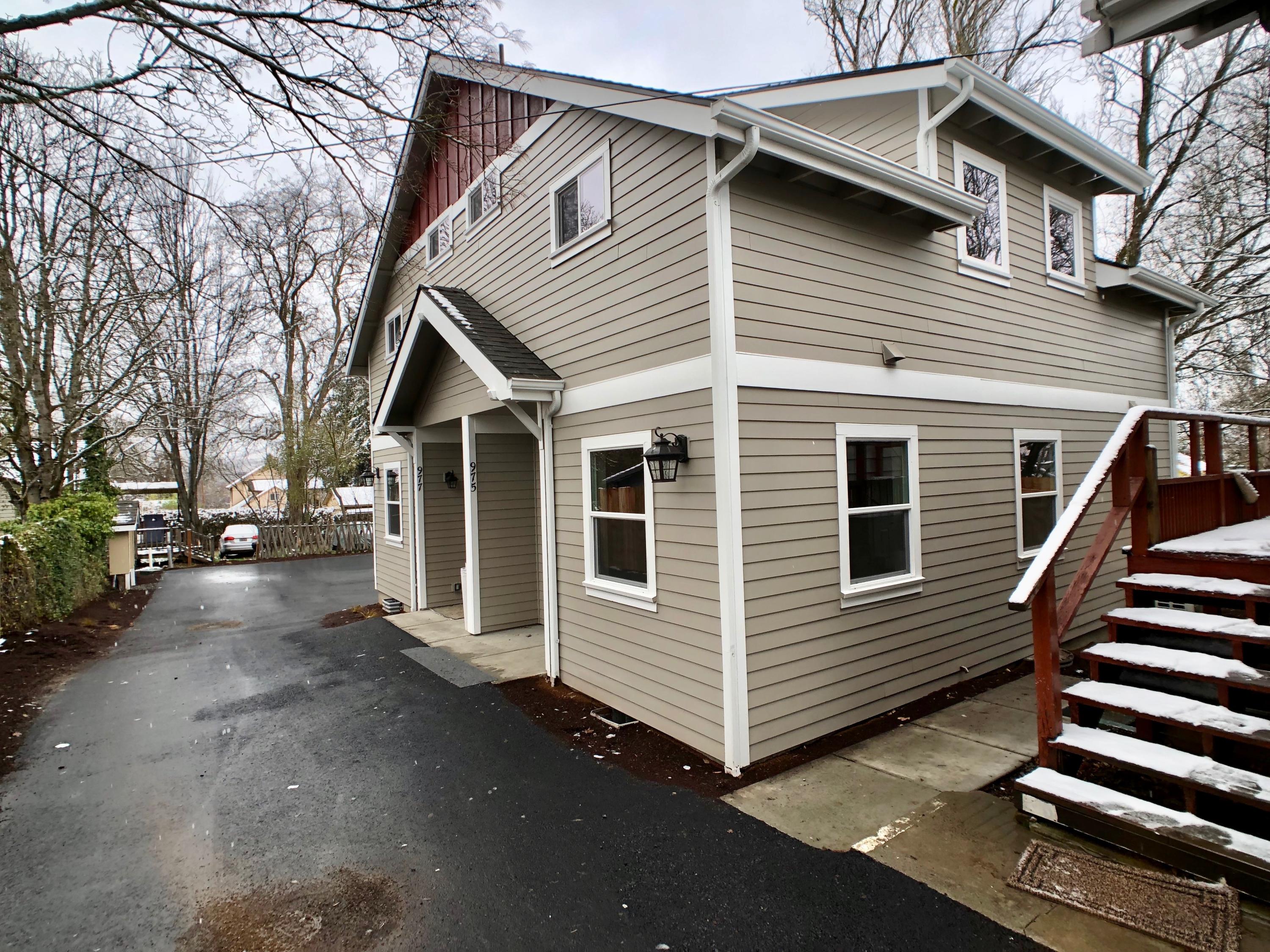 971, 975, and 977 Siskiyou Blvd. Extremely hard-to-find Ashland three unit property! Unit 1) 1940 built - 1713 sf single level with 3 beds and 2 baths completely remodeled from the ground up in 2018.  Units 2 & 3 - 2018 built - detached duplex with 875 sf on each side. Each unit includes 1 bedroom and 1.5 baths. The light filled duplex has vaulted ceilings, stainless steel appliances, and vinyl wood plank flooring. The upper level is entirely devoted to the owner's suite with a loft style bedroom, full bath, bonus space, and a walk-in closet. The property includes separate electrical meters for all units and a large private parking area across from Southern Oregon University. All three units are currently rented with monthly income totaling $5,350. The listing photos were taken in 2018 at the completion of the house remodel and duplex new construction.