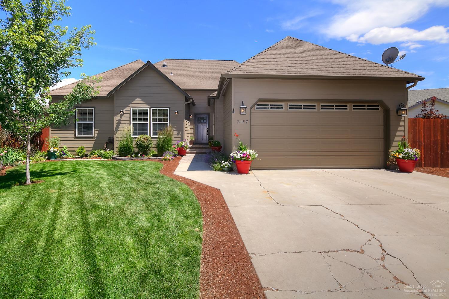 Entertainer's dream in a great NW Redmond neighborhood. Single level, Open, great room layout w/high end finishes & industrial touches. Soaring vaulted ceilings, exposed beams, lg rooms & closets, huge master w/vaulted ceilings, sitting area, double head tiled shower, walk in closet. Wood, carpet & tiled floors. Concrete, granite & tiled counters, Brazilian slate, premium finishes. Multi level deck, paver patio, pergola, hot tub & huge fenced back yard w/picture perfect landscaping. Private den/office.