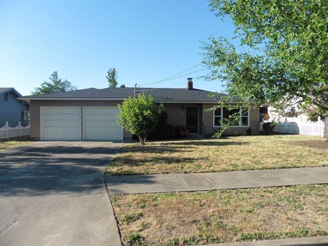 Wonderfully updated home on a quiet East Medford street situated on a large lot. Huge backyard offers lots of room and a large partially covered deck. Step inside this 3 bedroom 2 bathroom home that offers updates including interior paint and flooring throughout. New counters/back splash, cabinets and new stainless applainces in the kitchen. The large living room offers tons of natural light and a fireplace and the bathrooms have been updated. New doors and fixtures throughout. Home includes a new roof as well. This place really shines!
