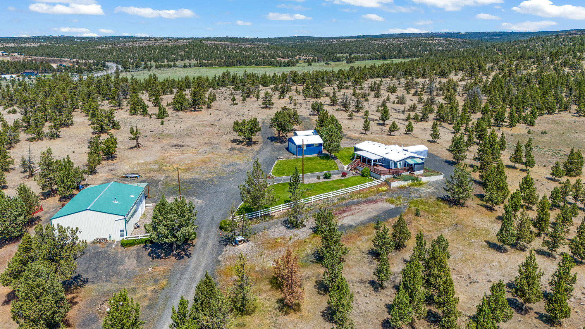 SELLER IS MOTIVATED! Discover the perfect blend of space and functionality with this charming, well maintained 3 bedroom, 2 bathroom manufactured home built in 1995, situated on 26.28 acres. Featuring a 2 car garage, RV cover, and a 1728 sqft 2 bay shop with concrete floors and power, this property is ideal for those needing extra storage or workspace. With 2 tax lots, the land presents and exciting opportunity. Whether you're looking for room to spread out or a unique property with endless possibilities, this could be the one for you! Buyer to do due diligence.