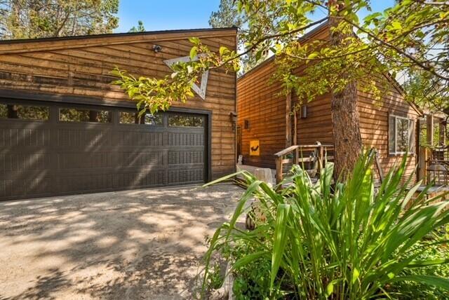 This property is not just a residence; it's a unique retreat & experience waiting to be shared. Step into this exceptional home and incredibly comfortable living space. In addition to the main home, it offers an additional  detached multipurposed artist studio/ ADU as well as an attached sunroom that can be used as a greenhouse or yoga room. Easy access to local attractions, parks, & dining, welcoming the best of Bend living. This home has a unique design, both inside and out, full of thoughtfully custom crafted artistic flair that brings a welcoming ambiance. A spacious, light-filled layout perfect for entertaining or enjoying quiet moments. The gourmet kitchen is equipped with modern appliances, sleek countertops, and a pass-through window and bar counter opens to the outdoor living spaces. Fully ''remodeled'' custom guest bathroom, new windows, as well as new features in the kitchen. Primary suite has its own private patio creating its own unique space by the pond and water feature