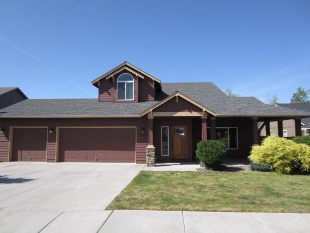 This gem in NW Redmond will not disappoint. Great location in a quiet established neighborhood. New flooring throughout including laminate wood floors downstairs and carpet upstairs. Very livable floor plan with lots of natural light, great for entertaining. Gas fireplace and Central AC to maximize your comfort. Master suite features vaulted ceilings, dual vanities and his/hers walk in closets. 3 car attached garage, covered front porch, paver patio and a huge fenced yard with a sprinkler system.