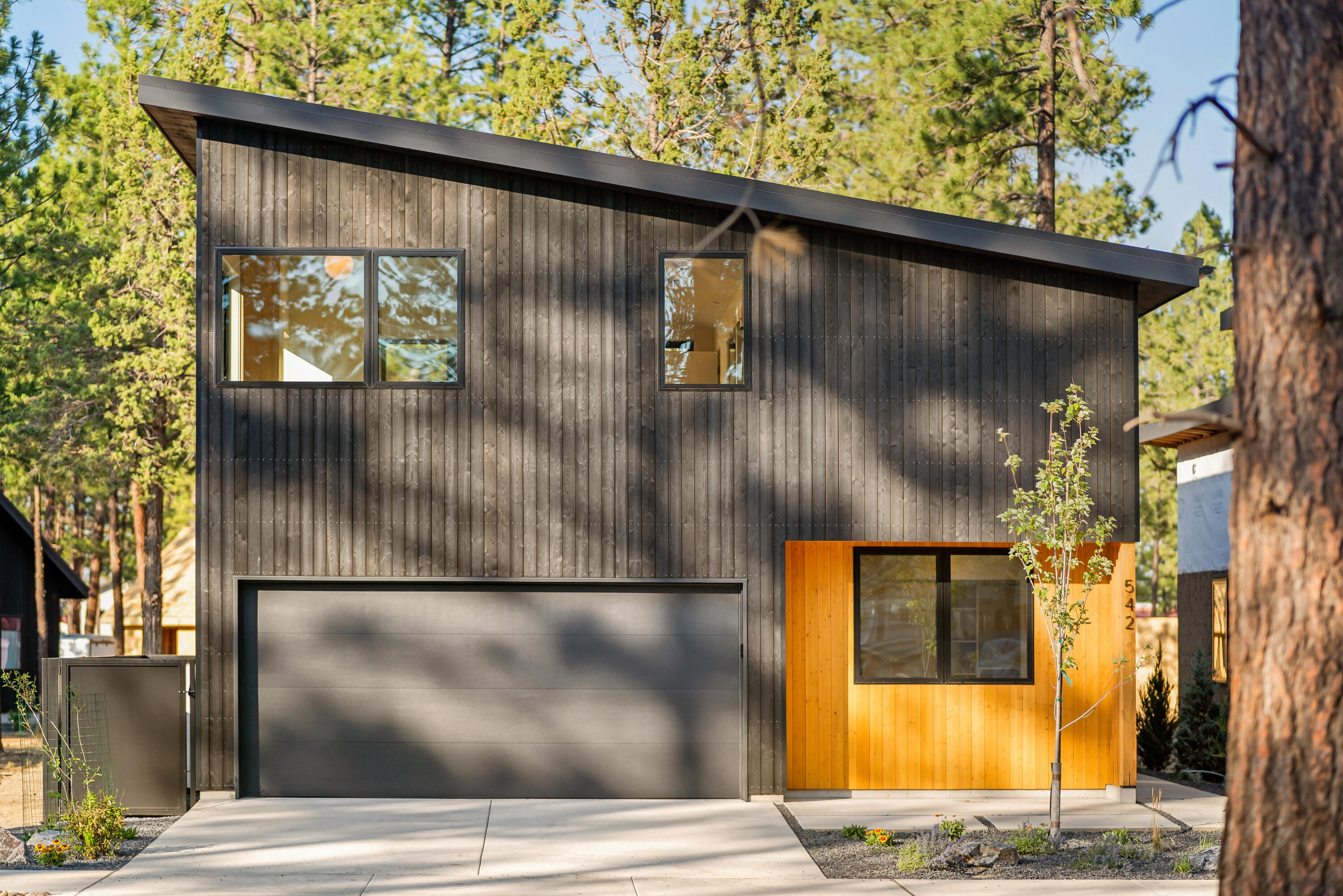 Sisters Woodlands Canopy Cottage has upper primary living space, allowing the architecture to unlock a unique relationship with surrounding trees. Upper level has an open floor plan, connected to a large exterior deck. High quality design & build is sustainable, durable & efficient for turnkey/low maintenance dwellings. Enjoy all Sister's Area offers with easy walkability from this mixed use community to downtown & wilderness. Interior features: Hardwood/tile floors & quartz counters throughout; Stainless high-end appliances; Ductless HVAC. Exterior features: Larch Shou Sugi Ban burnt siding (fire/pest resistant); Metal roof; Private front/rear patio; 2 car garage; Direct connection to private landscape & common amenity area; Solar/EV charger ready. 3 bedroom or 2 bedroom (larger primary) option. Pictures are of prior completed Canopy. Visit model home at 631 N Sisters Woodlands Way. Homes being pre-sold prior to construction.