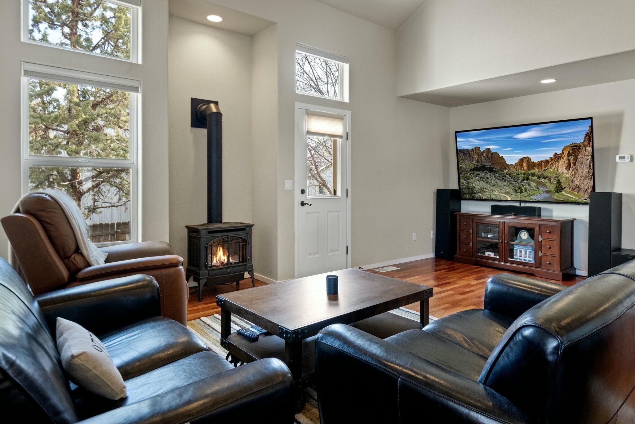 This cozy townhome is ready for your primary home, income property or 2nd get away! After hitting the slops warm up by the gas stove or soak in the primary baths jetted tub. Builders Choice unit, built by original owner. You will have plenty of room in this 1,887 sf, 2-story, end unit with an extra 400 sf. Cherry hard wood floors throughout spacious great room featuring vaulted ceilings and natural light. Entertain guests at the dry bar and hang out on the back deck or large roof top deck. Kitchen features built-ins, storage, accent lighting, Kitchen Aid appliances and dining area with bay window.  Primary on the main with ensuite bathroom and walk-in closet. 2 bedrooms and 1 bathroom upstairs for your family and friends. 2-car garage with room to store your winter and outdoor gear. Low scape yard allows extra time on your hands. Quiet community with walking paths, pond, fountain and gazebo. Less than 30 minutes from Bend, close to downtown, airport and Central Oregon's playground!