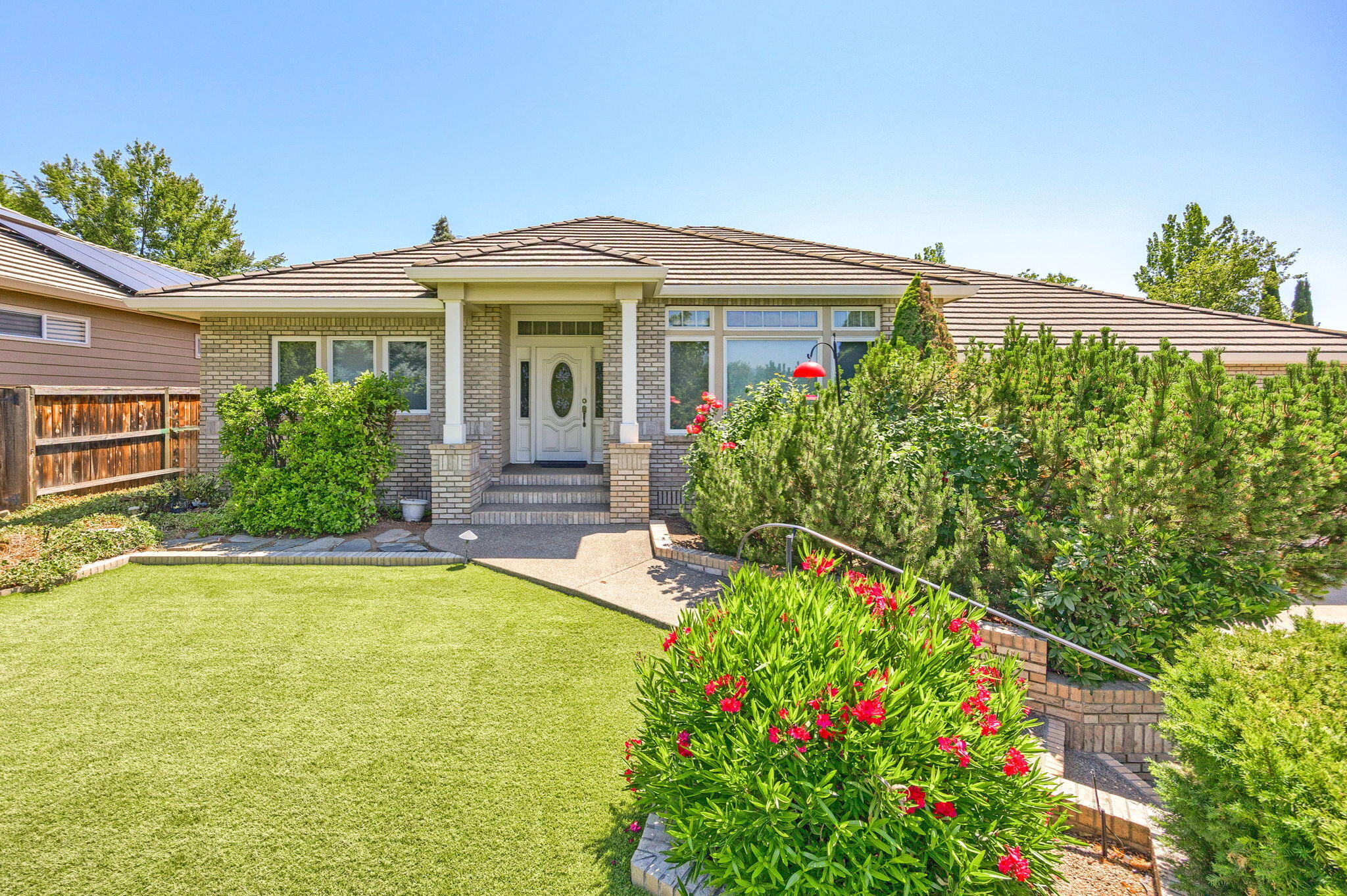 FIRST TIME on the market since being built by Steve Asher in 1996. An executive ranch style home with minimal stairs to the front entrance is a single-level home and features 4 Bedrooms or 3 Bedrooms plus an office and 2.5 baths. You open the front door to an airy and well-lit living room with views on the Rogue Valley mountains and city lights. This open concept floor plan is 2,872 sq. ft with hard wood floors and a cozy fireplace in the den. High ceilings and a primary bedroom with French doors that open up to the private back yard. The home has a tile roof and an oversized 2 car garage with a small shop / work bench area. This location is close to shopping and desirable schools. A very well taken care of home. Schedule a showing today.