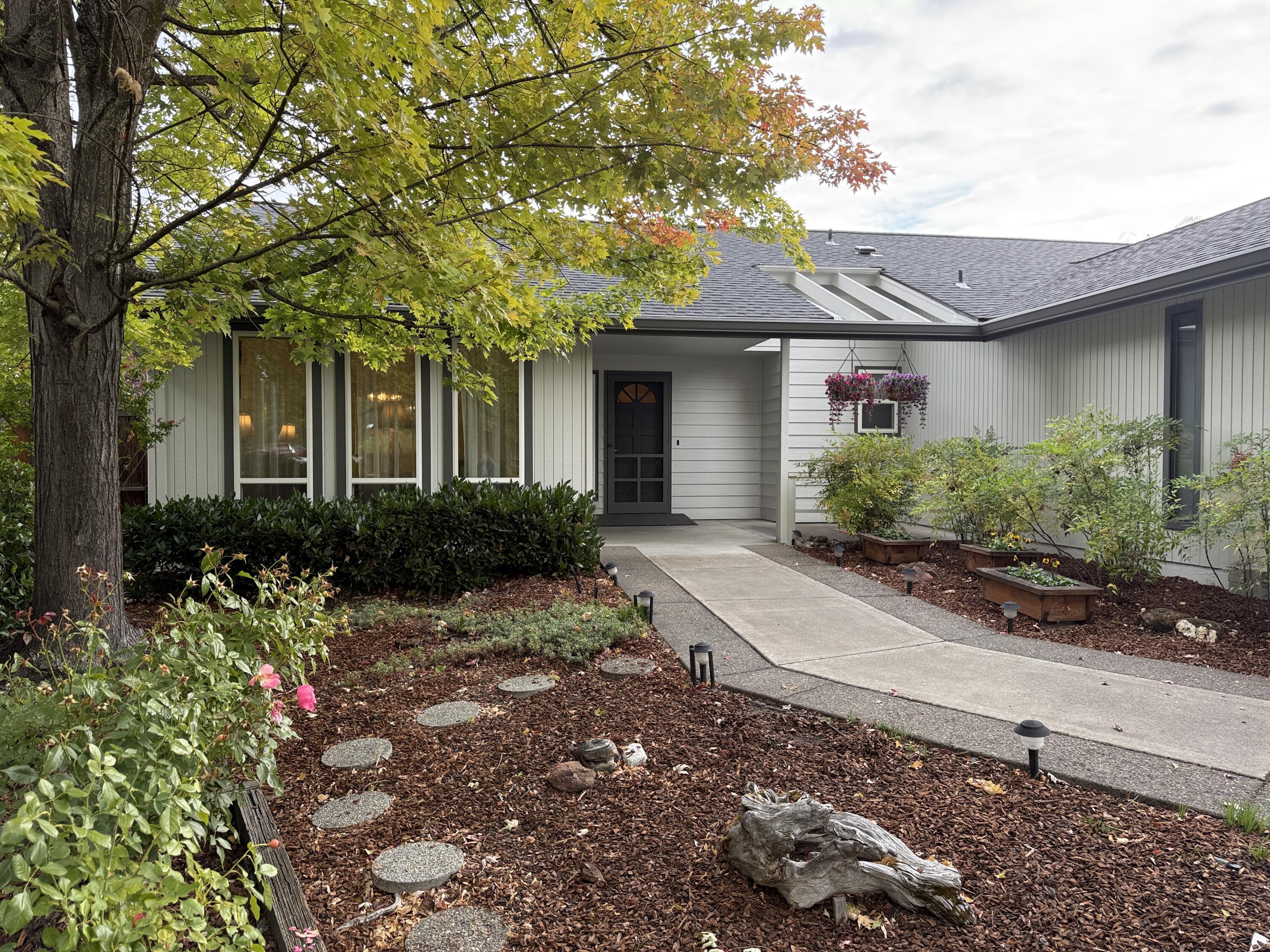 Open House Saturday Oct 11, 1-3pm 
First Time on the Market!
Don't miss this rare opportunity to own a little piece of paradise in desirable East Medford. This bright and cheery home has been lovingly maintained by its original owner for 34 years and is now ready for its next chapter.
Nestled along a peaceful creek with no back neighbors, this property offers privacy, serenity, and space to enjoy. The home features a formal dining room, living room, and family room, giving you plenty of room to entertain or relax.
Outdoors, you'll find an enclosed custom garden, a private back patio, and a beautifully landscaped yard — truly a gardener's delight. Additional highlights include a custom-built shop, RV/boat parking, and a 2-car garage, new roof and exterior paint.
This is a special home in a great location — come see it before it's gone!