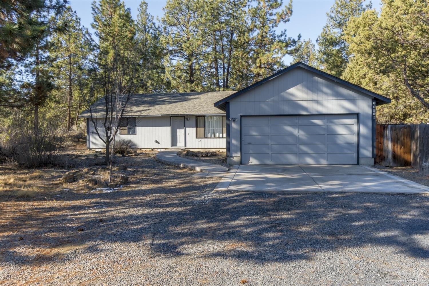 Plenty of room to build your dream shop, park your toys and create your own private Bend Oregon paradise on this .95 acre flat, wooded lot. Well cared for light & bright single story home in Woodside Ranch Phase 5 on a cul-de-sac. Inviting home w/vaulted ceilings, big windows & cozy gas stove, oversized heated garage and mud room with half bath! Low maintenance fenced backyard with sunny deck off the dining area. Just minutes to Old Mill & Downtown Bend and close to the parkway, public lands and schools.