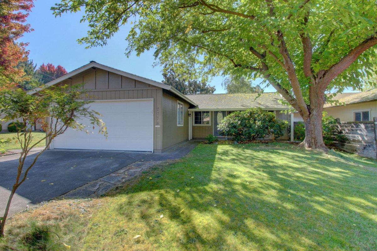 Beautifully maintained and cared for home in the heart of East Medford. Centrally located to shopping, medical and schools this home features a newer roof with ridge vents in 2016 with 50 year transferable warranty, new rear fence line, new in 2016 gas fireplace insert, and updated interior features including a remodeled light and airy Master suite with walk-in closet, bath and French Doors leading out onto the rear deck. Newer carpet, vinyl and laminate is included throughout the home, as well as an updated kitchen, and main bath. Surrounded by mature trees, foliage and landscaping, this private home will certainly impress.