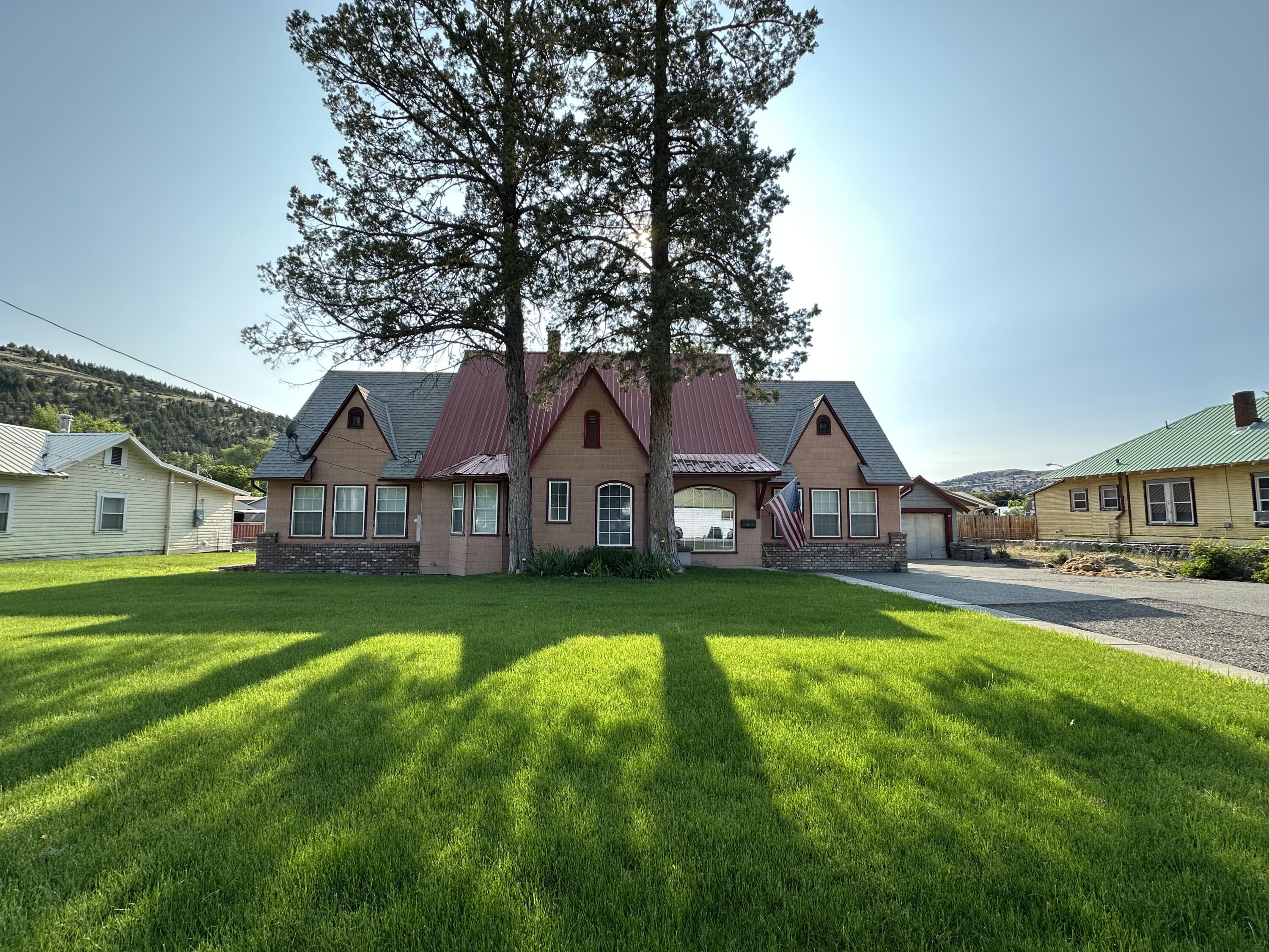 Main Home 212 NW Bridge: Two story  3 bedrooms 2 ½ bathrooms, 2330 sq/ft with additional unfinished 640 sq/ft basement. Primary suite with primary bathroom. 2nd bathroom and ½ bath newly remodeled. Living room & family room, single car garage, large 0.54 lot, new heat pump in Dec 2024, underground sprinklers front lawn, shallow well for watering.

2nd home 210 NW Bridge: Offers 504 sq/ft, 1 bedroom 1 bathroom, kitchen, living room, utility room with deck out back door. Heat source: Oil monitor stove. Great rental or mother in law suite. 
Both homes are on separate water, sewer and electric meters.