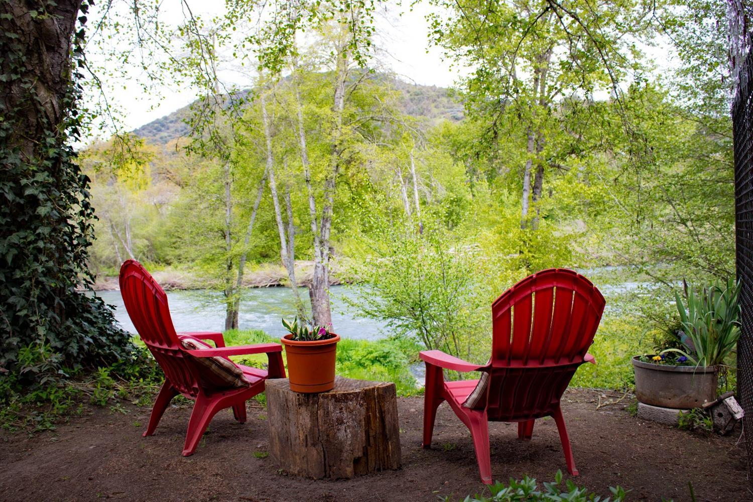 Southern Oregon Living doesn't get much better than this. This single level home on acreage faces a breathtaking stretch of the Rogue River. Unobstructed river access will make it difficult to leave home. There is a 1000 sq ft deck that runs the entire length of home. This home is very thoughtfully designed for capturing all that the property has to offer. Every section of this home has windows facing the river. Over 275' of river frontage on 2.57 acres. Inside is a completely casual elegant country feel. Modern kitchen, open floorplan, huge Master with slider onto deck. This home is ready to deliver the Good Life. Covered RV parking with shops and orchard will offer many possibilities for you. Room to enjoy while privacy abounds. Minutes from Airport and Medford. Golf course nearby. Move in ready. Even room for your chickens. This will be your family gathering place for generations to come!