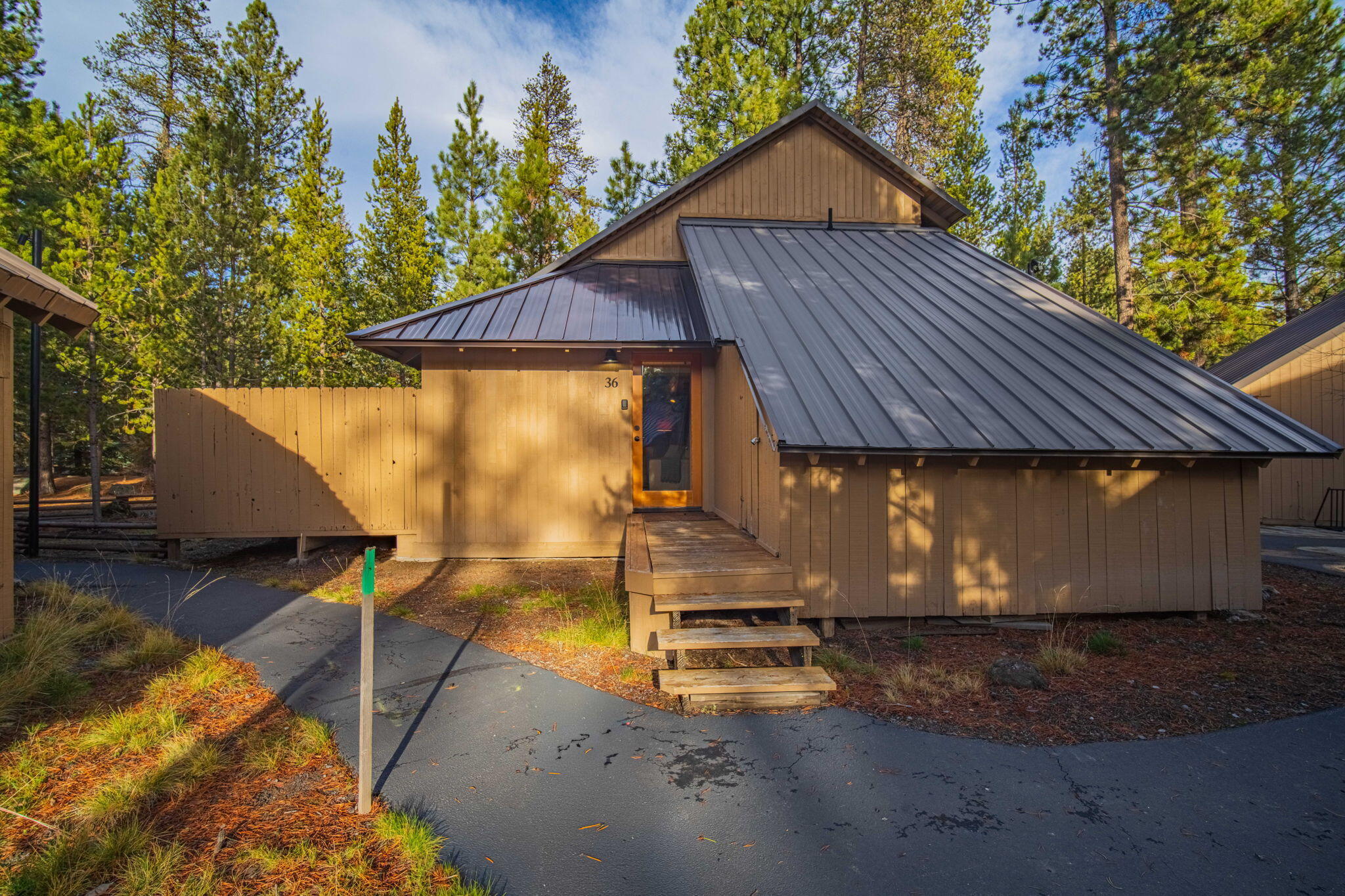 Escape to your own storybook two-story cabin in the woods- in one of the very best locations in SR. The original all pine wood cabin has 2 bedrooms, 2 baths, w/abundant storage & a separate laundry area. Recent upgrades incl A/C, remodeled bath, new deck & new entry enclosure. Sold furnished. Successful short-term rental. In a condo assoc. that provides ease of community living yet a stand-alone cabin for privacy. Cabin is entirely owner maintained and insured. Quarterly asst incl garbage service, snow removal to your door, grounds mtc., making ownership effortless year-round. Close proximity to Village, river and Century commons. Level terrain, ample parking, & a durable metal roof adds long term value & reliability. This property is perfect for investors or those seeking a cabin getaway in SR. Furnished with the exception of personal art, travel & decorative items, this cabin is a rare opportunity to own a turn-key retreat that blends relaxation, recreation and rental potential.