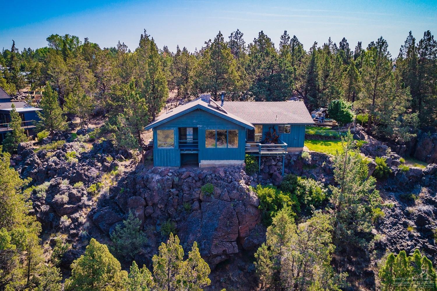 This is a one of a kind, custom home, built directly on the banks of the Deschutes River, with an unobstructed, breathtaking view of the entire Cascade Range! This home has three bedrooms, 2 full bathrooms, a fireplace, granite countertops, solar hot water, detached oversized two-car garage, 2.8 irrigated acres, with a beautiful terraced garden area. Roof less than 8 years old. This is a must see! Call or text to schedule your appointment today!