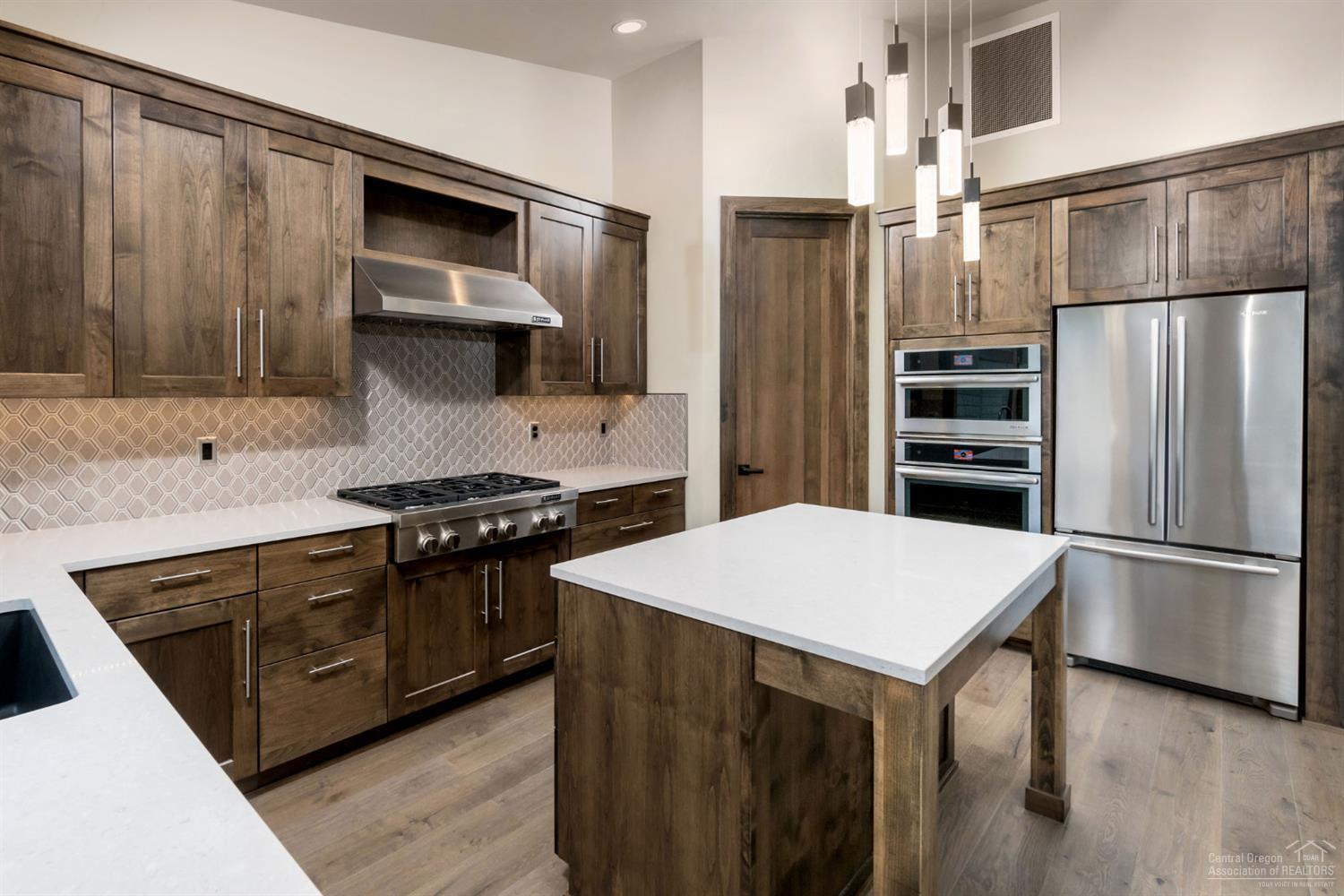 Be one of 5 lucky buyers to enjoy the new luxurious town homes available in gorgeous Broken Top. With master on the main level and decks overlooking the lake in Painted Ridge it doesn't get any better. Did we mention Pahlisch Homes high quality and standards? Enjoy long walks & easy living. Peaceful and private location behind the gates in Broken Top w/tennis, swimming, club house & walking trails. 5unitPRBtownhome2-2724-2.