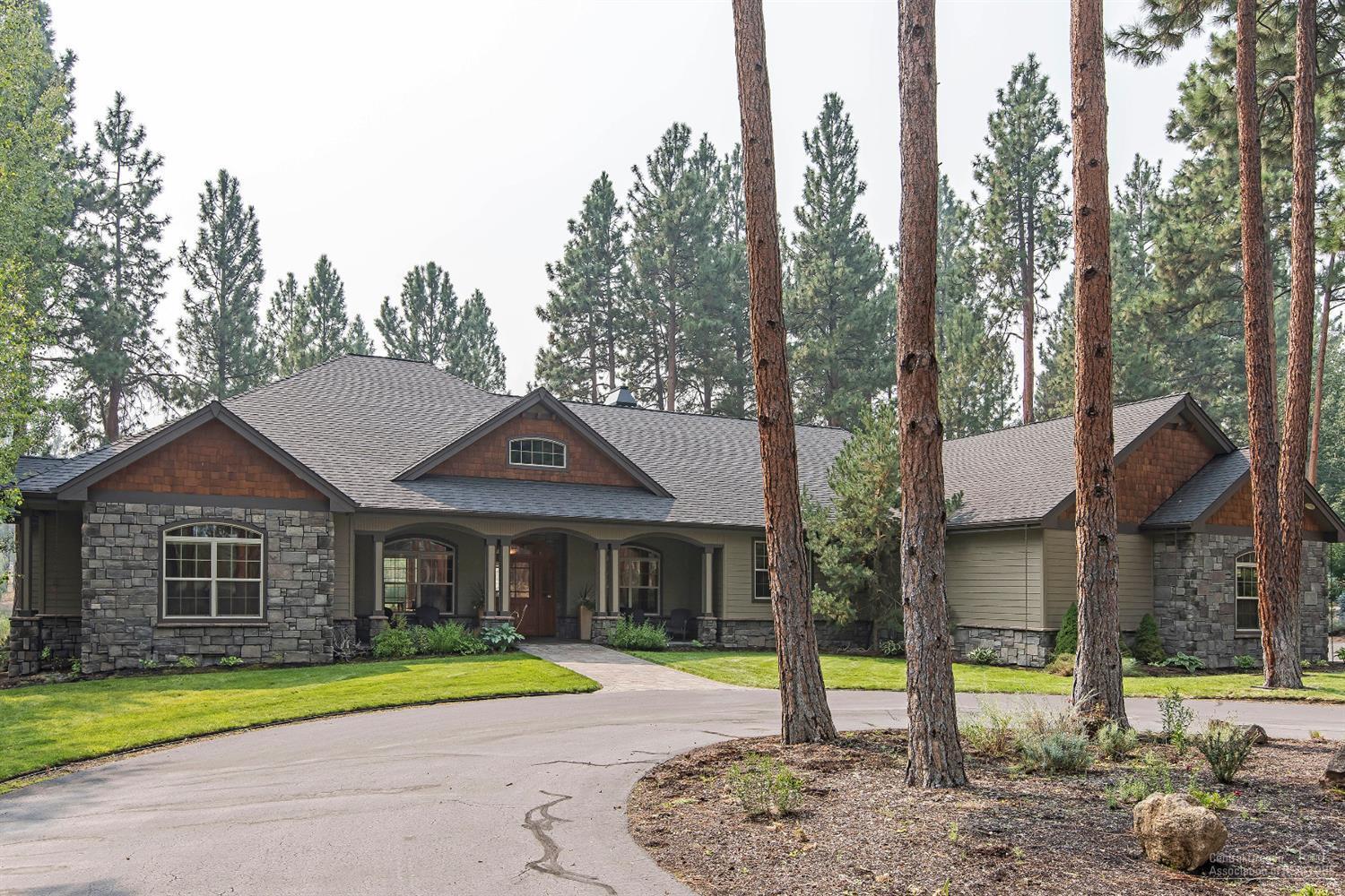 Country elegance at its finest. This custom home has it all. Two master bedrooms and one master suite, three full baths, two half baths, coffered ceilings, slab granite, walnut flooring and stainless steel appliances. Floor to ceiling built-in cabinets on both sides of natural stone fireplace in the living room and views of three ponds and the 16th fairway from the house and paver patio. Too much to list - a must see! Community pool and tennis courts.