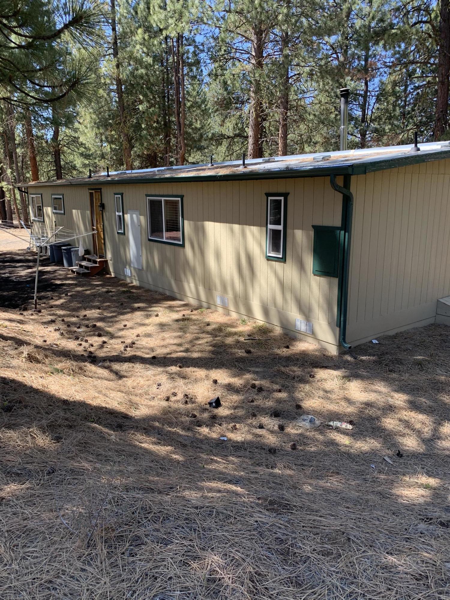 Private 2 bedroom, 2 bath home on 2.31 acre lot at the corner of White Horse and Solomon.  Large insulated shop with overhead door and sliding door for your vehicles and toys.  Hickory cabinets in kitchen.  Island with pendant lights and bar seating.  Newer well pump.  Appliances included.  Seller states that lot to west is not buildable, so privacy should be assured.