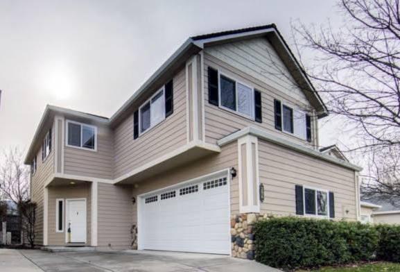 Immaculate town home with environmentally sensitive & high end finishes. Very desirable floor plan with main level master suite with vaulted ceiling & sliding doors to a garden area & covered patio. Master bath has a large walk-in closet. The living room, dining room, and kitchen have an open floor plan with hardwood floors and carpet. The living room has an electric fireplace and sliding doors to outside patio/garden area. Spacious kitchen with eating bar, pantry, granite counters and chopping table with granite top. Upstairs are two bedrooms with walk in closets and views of the mountains. Large, open area upstairs with hardwood floors that overlooks the downstairs. Also upstairs is a large bathroom with a claw foot tub and a laundry room with cabinets and sink. Two car attached garage. Enjoy the park like open spaces with seasonal creek. Perfect location near shopping, schools, SOU and easy access to I-5. Landscaping and lawn maintenance are paid by HOA.