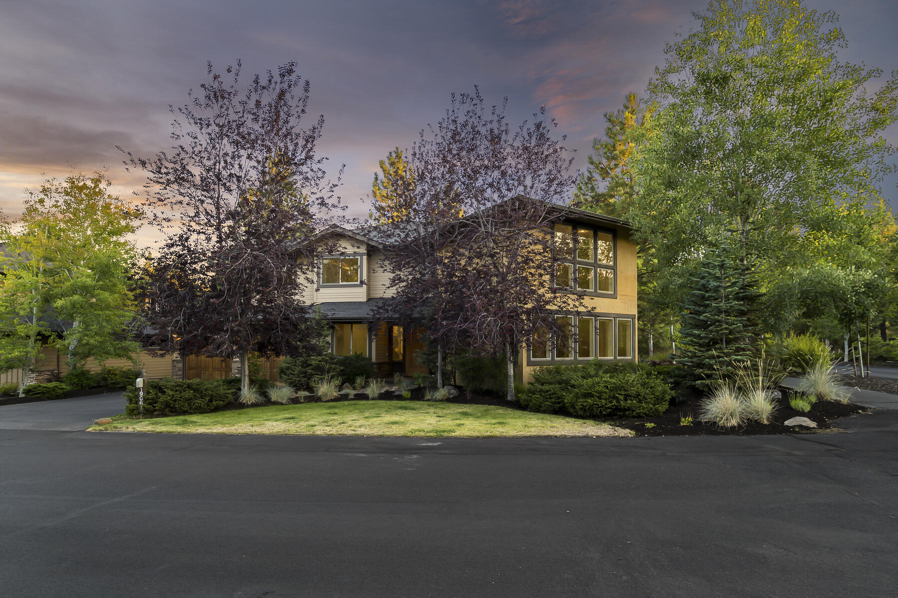 This beautiful custom home is perfectly nestled among the trees on a peaceful corner lot in the desirable Three Pines neighborhood in NW Bend adjacent to Shevlin Park and endless miles of trails in the National Forest beyond. The spacious interior features new paint, a towering 2-story living room flooded with natural light, numerous built-ins and a well-appointed chef's kitchen with Wolf and Sub-Zero appliances plus an expansive granite topped island perfect for entertaining. The main level has two eating areas, a pocket library, den/office, two powder baths and laundry room. A floating wood and steel staircase leads to a comfortable primary suite with gas fireplace,  peekaboo Cascade views and large ensuite bathroom with rainfall shower, soaking tub and dual walk-in closets. Space for family and guests with a junior suite and two additional bedrooms and 3rd full bath. Complemented by a rare fenced yard for the neighborhood and 3-car tandem garage, this is Bend living at its best!