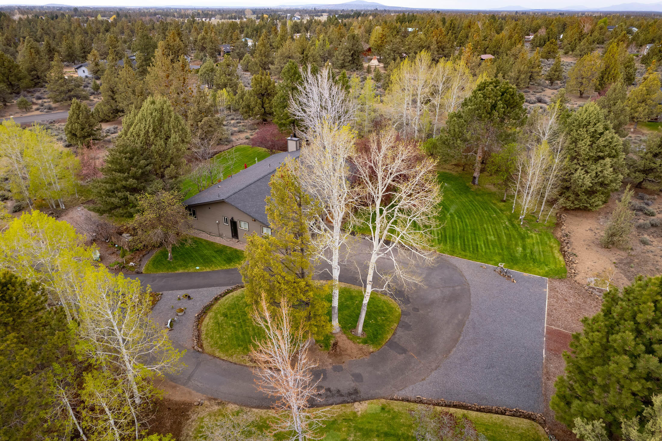 Experience peaceful country living near Bend's city amenities on 4.04 beautiful acres of property in Los Serranos.  This single level contemporary farm house has been meticulously maintained and was recently extensively remodeled inside and outside boasting quality through-out.  New kitchen, bathrooms, hardwood flooring, windows, mud room, roof, siding, HVAC and so much more.  Separate 32' x 48' x 11.5' , 30 amp/220v pull thru shop.  Location is approx. 3 1/2 miles to restaurants, Costco, WholeFoods, Safeway, coffee, parks, & St Charles Medical Ctr.    A must see as this lovely property is truly a dream to be appreciated. SEE VIDEO TOUR