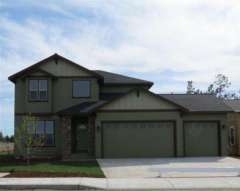 NW Redmond--what a terrific location with quality all around you. Vista Meadows is the place to be. Large 1929 SF home with 3 bedrooms plus a den that could be the 4th. Inviting foyer leads to the open great room that features a cozy fireplace with custom mantle. The kitchen has tons of cabinets and countertops that allow for storage and food prep. Upstairs, the master suite boast a tray ceiling with spacious walk-in closet. A three car garage, front and back yard landscaping and sprinkler system.