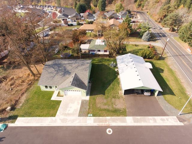 Two homes for the price of one! Situated within walking distance from the city of Rogue River, these well cared for frame built homes are priced to attract investors. Or if your looking for your dream home, live in the new home, rent the second out and enjoy the savings. The main home boasts large south facing windows outlooking the mountains. The open floor plan and large kitchen allow your creativity no limits in decorating this space. As you step in the second home you will be greeted with a clean comforting layout. Remodeled back in 2014 the second home has been thoroughly inspected with all issues repaired. Enjoy years of minimal maintenance living in the desirable town of Rogue River between Medford and Grants Pass.