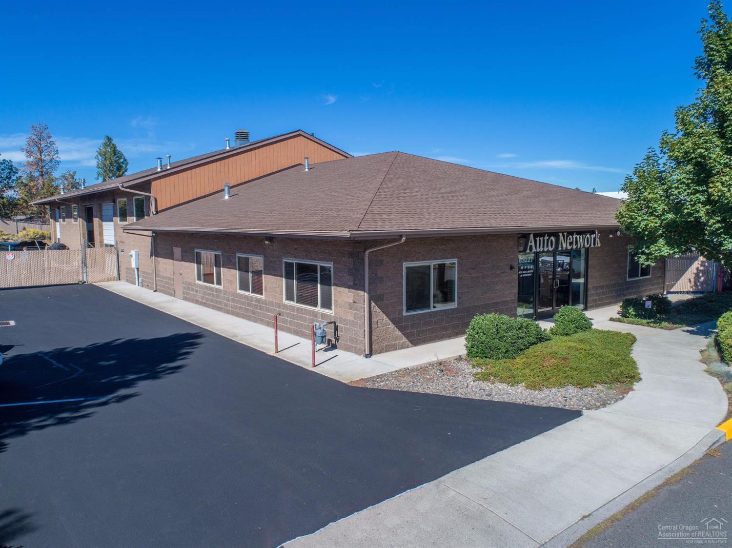 2 tax lots with 1 building. 63227 Service Rd: 0.79 acres, with 7,200 +/- SF building; 63235 Service Rd: 0.77 acres. CMU block building includes large showroom, five (5) executive offices, large service counter and three (3) 14' roll-up pass thru bays for shop area, giving access to the oversized parking lot. Secure complex with fencing and three (3) separate slider gates. 42,353 +/ - SF of buildable land allowing for additional square footage of buildings. Fire hydrant/water services to back of addt'l lot
