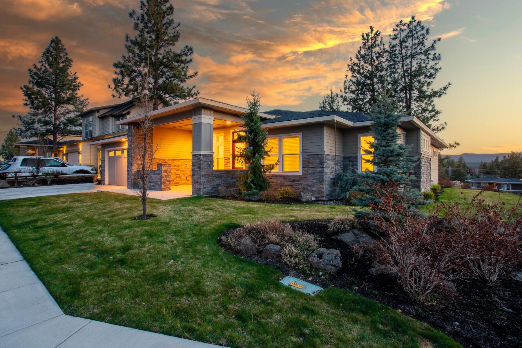 Located on Bend's desirable westside, this stunning single-level, 4 bedroom home is the former model home of Shevlin Estates. Featuring an open floor plan with an additional office, high ceilings, and modern, luxurious finishes, this home offers the refinement and versatility that buyers crave. With an expansive entertaining island in the kitchen and multiple options for outdoor living, this home is perfect for hosting guests and making unforgettable memories. With long ranging views of the Cascade Mountains and national forest to the west, this home brings the outdoors in from almost every room. Located just a stone's throw away from the vibrant shops, farmers market and dining of Northwest Crossing, you'll never be far from the excitement of Bend's westside. And if you're looking for outdoor adventure, the start of the Shevlin Park trail system is right across the street, providing easy access to some of the best hiking and biking trails in Central Oregon.