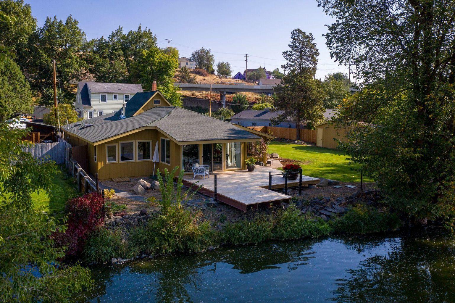 BREATHTAKING VIEWS from this amazing home right on the Link River! Kayak from your backyard or walk to Link River Trail, Lake Ewana,Moore Park and downtown. Sit back on the new deck and enjoy the otters, pelicans, eagles, and blue heron just to name a few. Notice the new landscaping including a fantastic water feature from a natural spring on the property and a on site garden house/shop that has lights and heat. Also updated kitchen appliances and a great open flow floor plan! It has a small loft upstairs that is currently being used as an office, but you could easily add another bed if you wanted. It's tucked off of the road and nestled up right on the river which makes it feel like you are off on your own but really centrally located . This is definitely one of those must see to appreciate homes. Let me know when you would like to take a look!