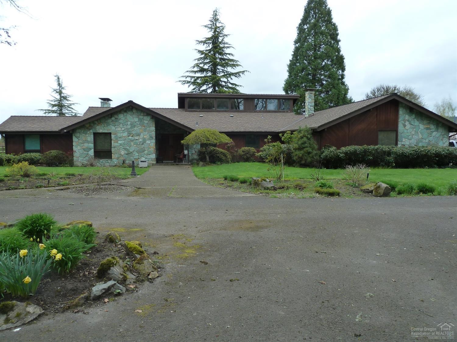 This outstanding 26,112 sq. ft. equestrian facility includes a beautiful 2438 sq ft home, indoor arena and several outbuildings. It is easily accessible. Property currently rented to HART for their adaptive horse training program. All outbuildings including arena have been exempted from property tax. This exemption will not apply to new owner. Buyer responsible for all due diligence.