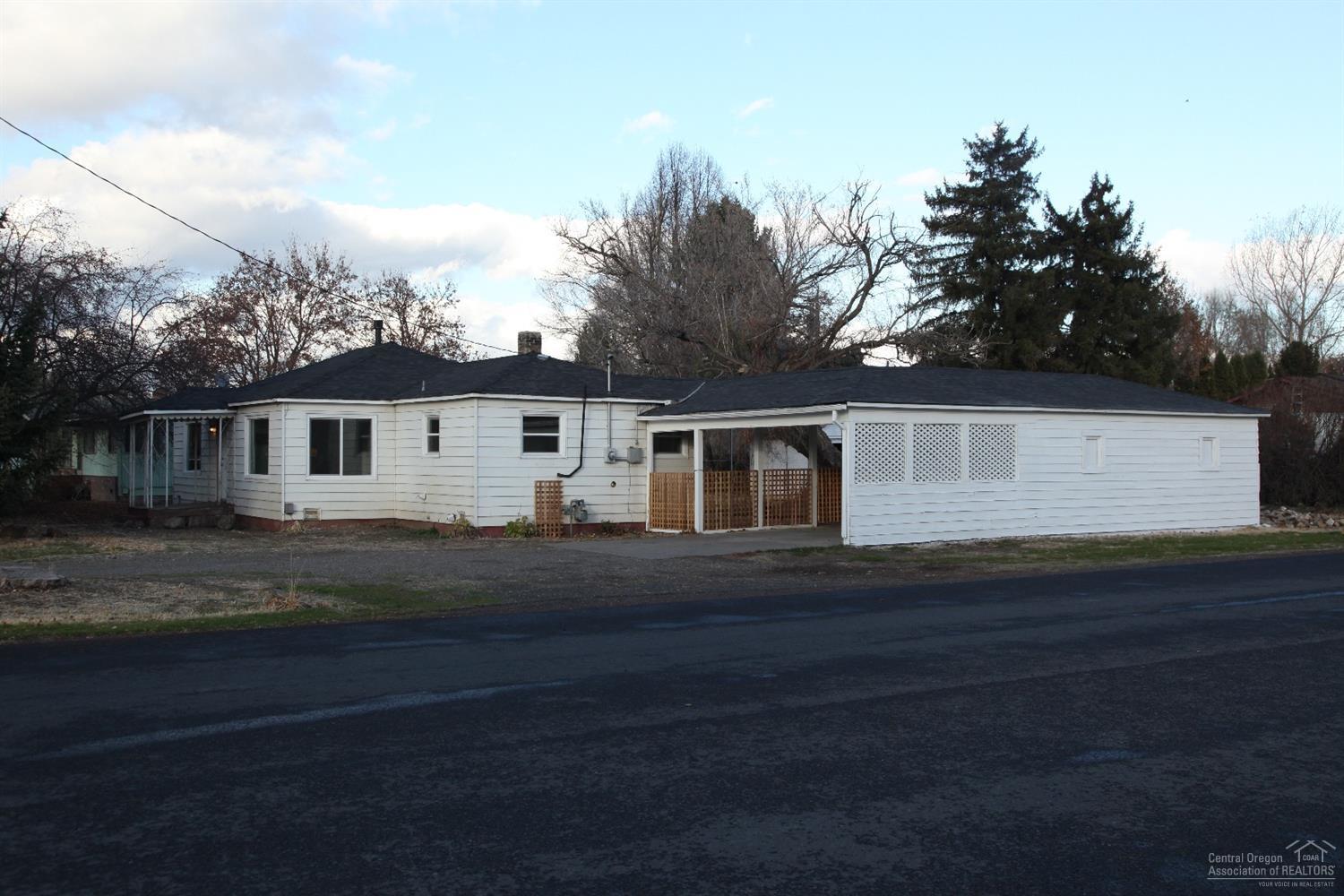Solid and comfortable home with spacious floor plan and fully fenced yard. New vinyl windows, refinished hardwood floors, updated bathroom and new paint inside. Included is an oversized one car garage with shop area, plus a carport, ample additional parking in driveway and on street. Owner holds Oregon real estate license. Listing agent is related to owner.