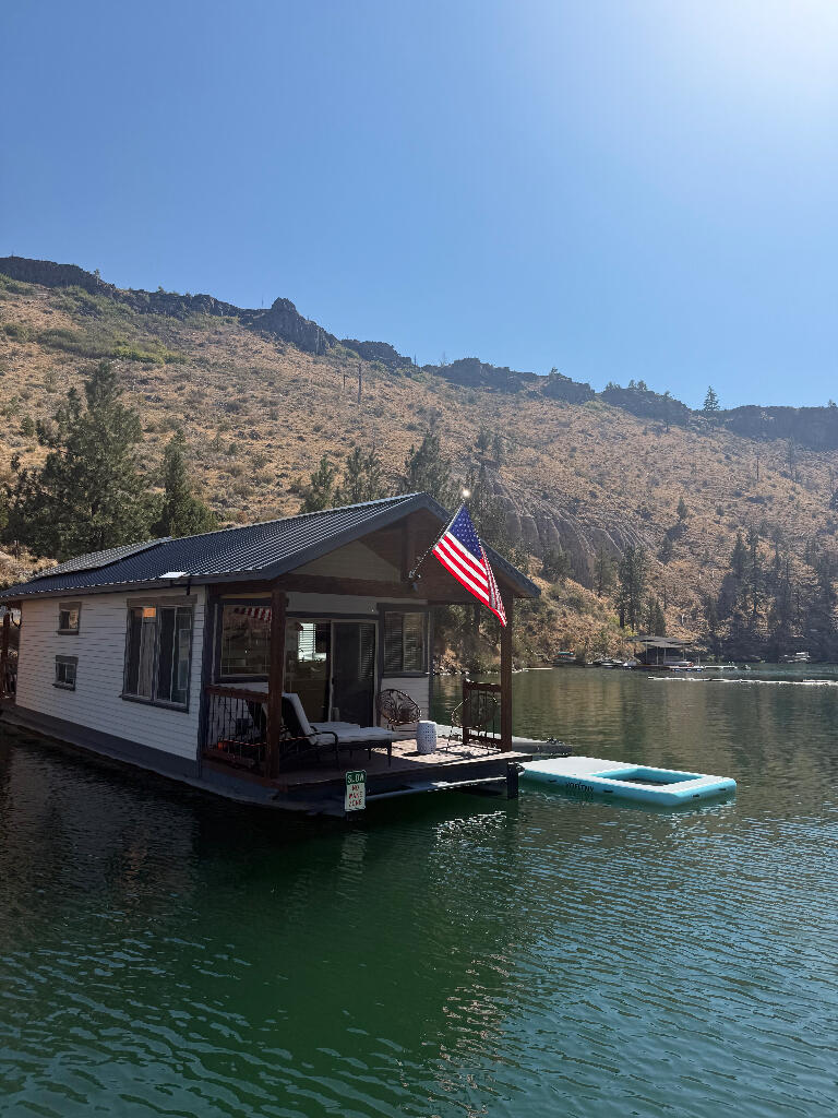 Rare Lakefront Gem on Lake Billy Chinook - Metolius Arm

Don't miss this unique opportunity to own prime waterfront property in the tranquil Fly Creek Cove on the Metolius Arm of Lake Billy Chinook. This offering includes Houseboat Slip #2—a coveted end slip in Lot 11 at Fly Creek—along with two deeded, dedicated parking spaces and the fully built from top to finish in 2018 floating home
Completely renovated from the ground up, the houseboat features a stylish, modern interior with:
• 1 private bedroom with a queen bed
• Built-in twin bunk beds
• Full bathroom with shower
• Designer kitchen with quartz countertops, propane stove & oven, refrigerator, microwave, and dishwasher
Solar powered for off-grid living, this floating retreat blends comfort, function, and adventure. Wake up to serene water views spend your days exploring the lake, and unwind with unforgettable sunsets—all in the heart of Central Oregon's high desert paradise. Lake life awaits with this rare one of-a-kind