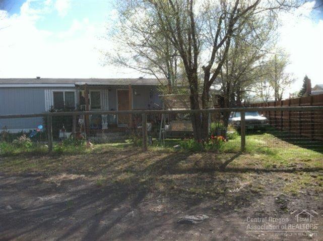 Property is located between 4th & 5th St @ corner of F Ave. Flat lot w/mature trees. New vinyl windows and new appliances installed in 2009. Covered front/rear porches, shutter accents, County shows the carport at 420 sq ft. Several outbuildings. Septic system was repaired/finaled on 1-10-06 which included a new concrete septic tank.