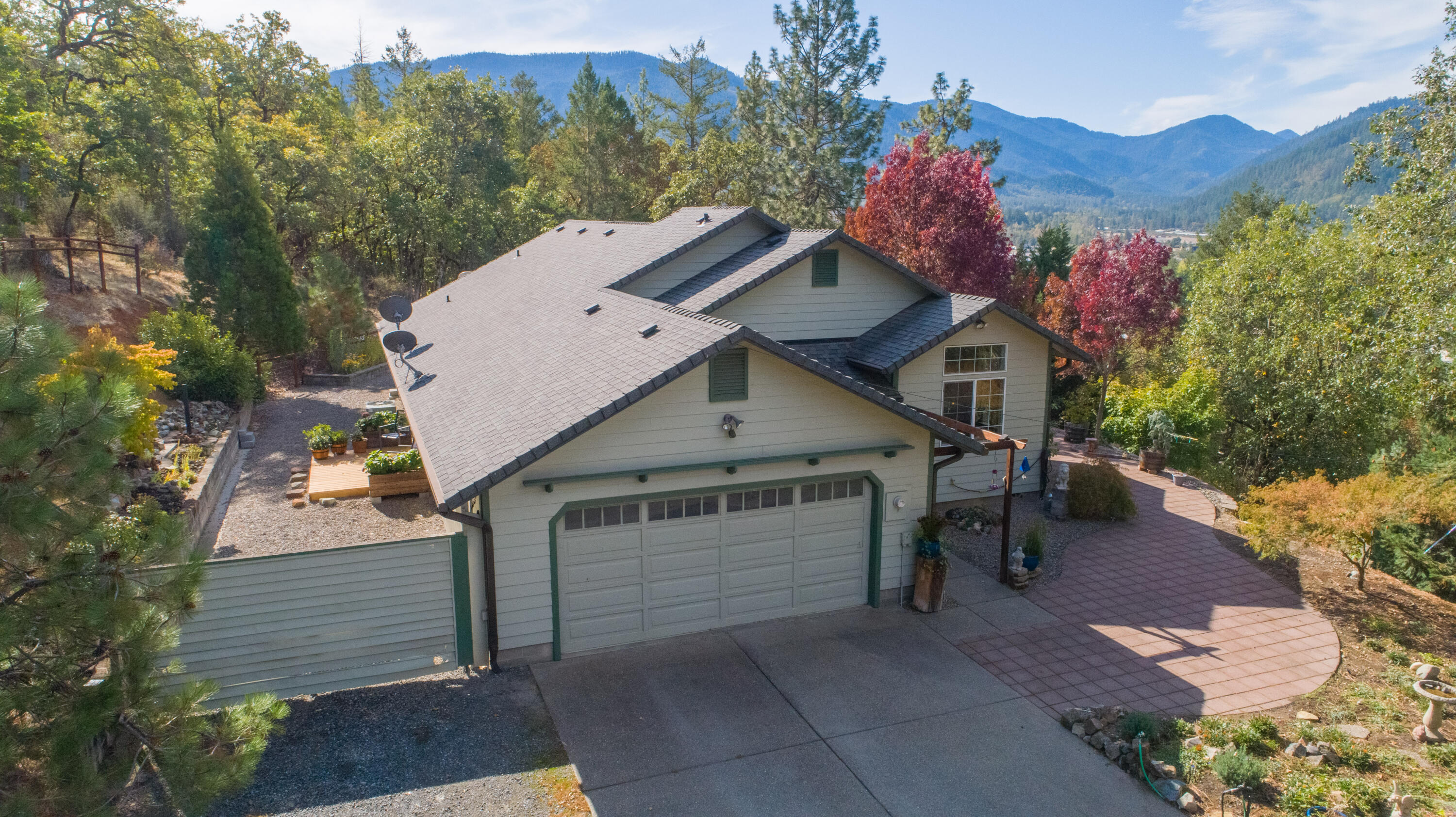 Gated Private Country Home on 5.55 picturesque rolling acres in desirable neighborhood. Light and Bright Home has picture windows, sliding glass doors throughout with beautiful views; 3bd/2ba, 1861sf, with granite-tiled kitchen, newer appliances & breakfast bar. Open floor plan. Multiple places to enjoy morning coffee or share the evenings together: Living Room has French doors to large beautiful patio; Family Room has slider to deck with pet friendly fenced yard and Primary Bedroom has French door to sunroom.  Split floor plan with two bedrooms and main bathroom on one side of hallway.  Primary Bedroom has walk-in closet and sunroom.  Primary Bathroom has a double-sink vanity, extra storage, toilet room closet, shower stall and large jetted tub for total relaxation! Laundry room has lots of storage cabinets (could be used as pantry, too) , sink and bar to hang clothes. Two car garage, fenced pasture area, room to park RV and all your toys!