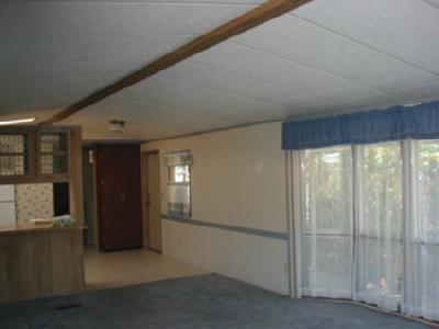 *Deep discount now. Cash sale required. Newer mfd home in clean, quiet 55+ Phoenix park. Vaulted LR, nice floor plan with bedrooms, baths at either end. Small, solid workshop with power - nice, easy care yard with patio, covered porch. Cable available. Oakhurst model. Seller will allow for carpet & some painting & repairs.