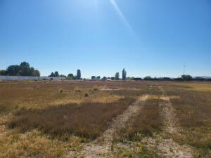 This commercially zoned lot could be the right place for your next project, and it is priced to sell! It is a longer strip of land approximately 200 yards long or so, and then widens out for the majority of the acreage. Could work well for a longer driveway, or possibly different types of storage units lining the road on the way to the larger portion. Some of the acreage is located on the other side of the train tracks (Approx 4-5 acres), as well as there are about 5-6 acres that have been mitigated and can not be built on. This leaves approximately 9-10 acres of usable commercially zoned land.
