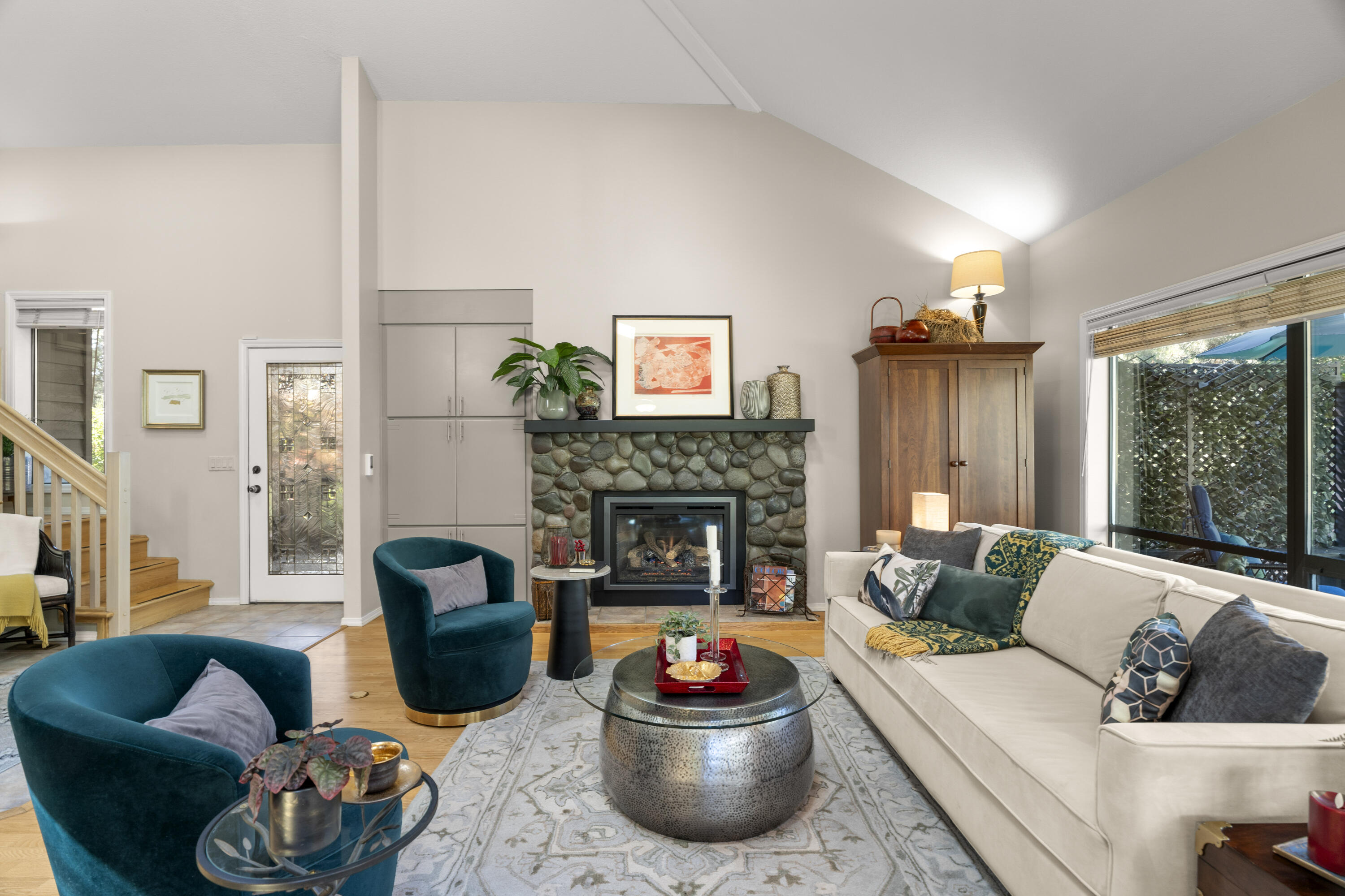 Beautifully maintained 3BR/3BA home in the coveted River's Edge community! Filled with abundant windows and natural light, this home features vaulted ceilings and an open layout. Enjoy mostly main-level living with the primary and guest bedrooms downstairs, plus an additional bedroom and loft upstairs. The spacious primary suite offers a private porch, dual vanity, soaking tub, and shower. A well-designed kitchen opens to the dining area, ideal for everyday living and entertaining. The back deck overlooks the golf course, and the oversized 1/3-acre lot provides mature landscaping and privacy on a quiet dead-end street. Ample storage, a 2-car garage, and long driveway complete this exceptional home - just minutes from river trails, restaurants, and shopping in a gated community.