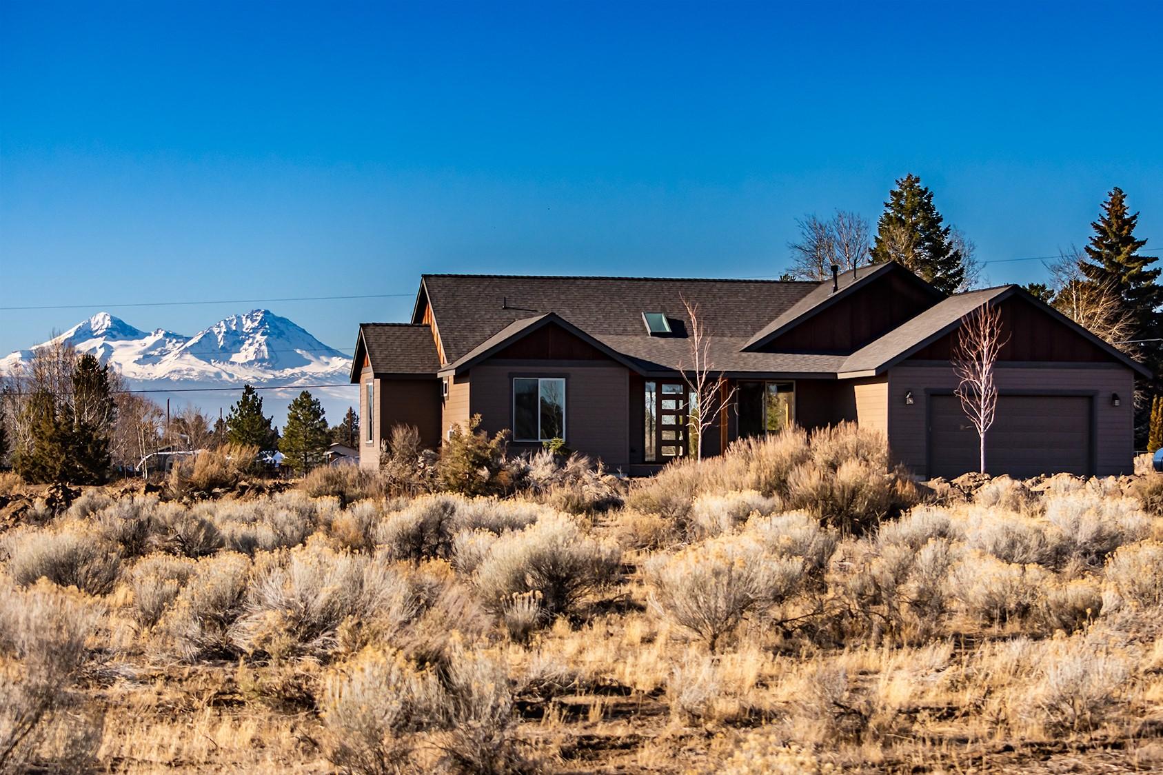 PRICE REDUCTION!!  
Brand New custom single story construction on 2.49 private acres with amazing panoramic mountain views.  Open living design with vaulted ceilings. Numerous upgrades:  Exposed beam, hardwood throughout kitchen, dining, great room and bonus/rec room; quartz countertops; black stainless appliances; skylights; 8 ft solid core doors; propane fireplace and stovetop; stacked stone fireplace surround, tile bathrooms and oversized master shower.  Large outdoor courtyard perfect for enjoying the views, relaxing and entertaining guests.  Plenty of room for rv parking or to build a shop. 
Real country living just minutes from both Bend and Tumalo. Horses and agriculture allowed, buyer to perform due diligence. 

Come check out this home and wake up to mountains from your master suite.