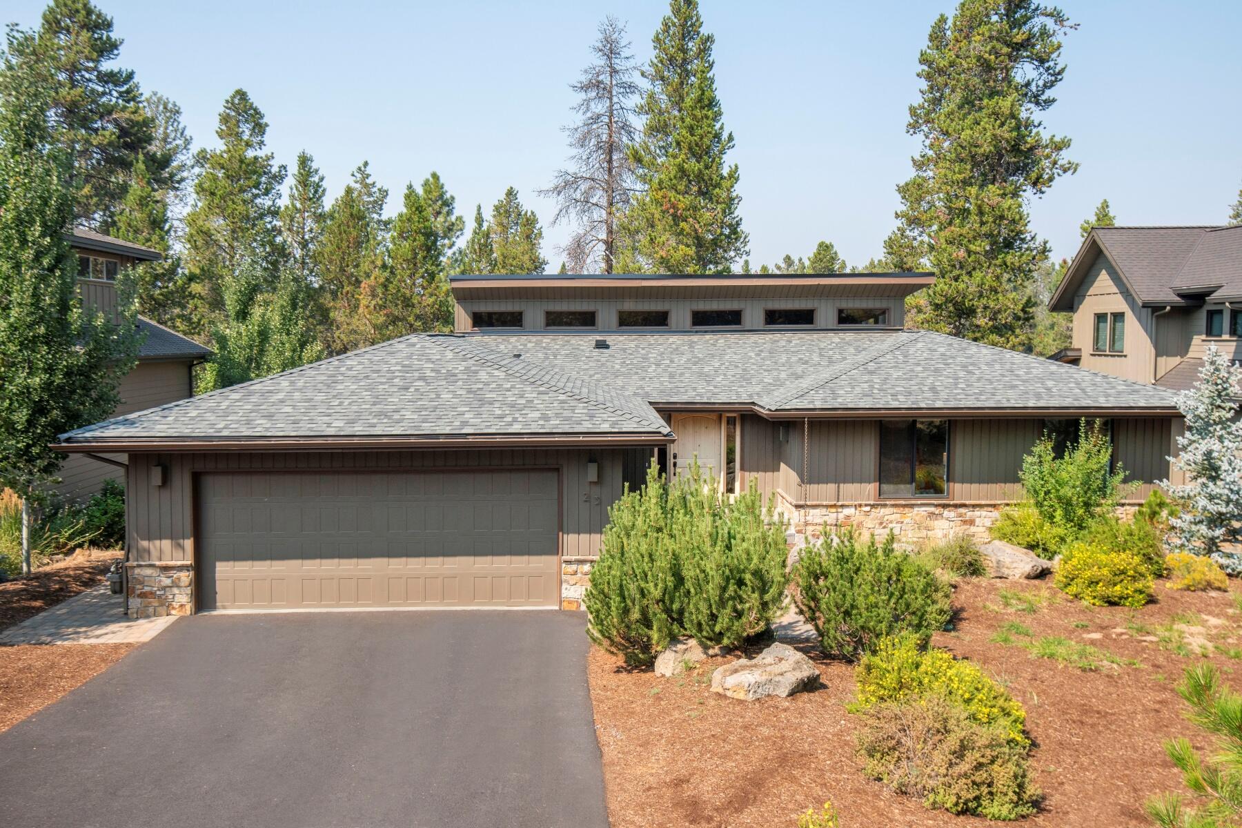 Experience the charm of a remarkable home situated in a one-of-a-kind location, nestled behind the tee box of the 18th hole on The Woodlands Golf Course. Expansive views of the 18th fairway plus filtered views of the lake-encircled green of the 17th hole. Originally a classic 80's Sunriver home, this home has undergone complete renovation, taken down to the studs and elegantly reimagined into a truly unique dwelling. The living space features soaring ceilings adorned with clerestory windows, which bathe the interior in natural light. An expansive back paver patio provides ample room for gatherings and relaxation. This home boasts 2 suites, a children's bunk room, and an additional guest bedroom, providing abundant sleeping accommodations for all. Highlights include new hardwood flooring, fiberglass windows, quartz countertops, and stainless-steel appliances, with all renovations completed in April 2023. This is a truly exceptional opportunity that must be seen to be fully appreciated!
