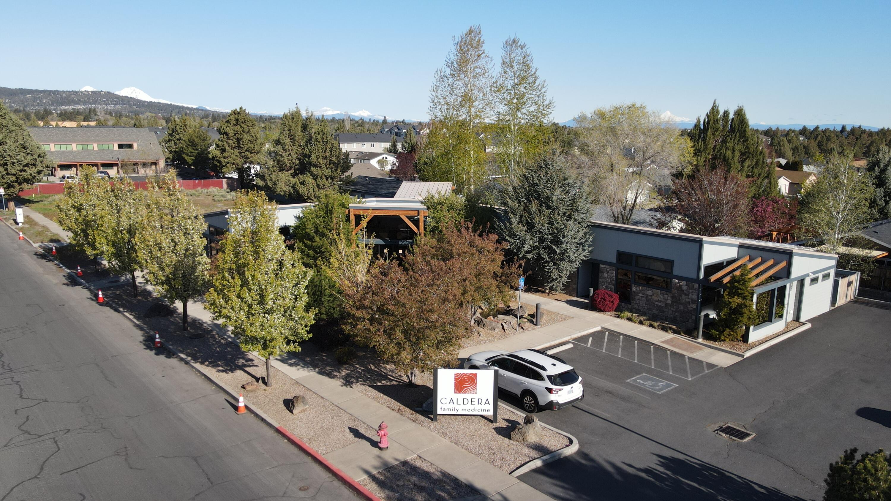 4,668 +/- RSF single story Medical building in NE Bend. Beautiful Modern Clinical Medical Facility custom built with monthly cash-flow with current Tenant, Caldera Family Medicine. Designed by BBT Architects, originally custom designed and built in 2010, One tax lot of 0.40/Acres (17,424/SF) zoned Residential Housing (RH) w/Medical Overlay. 11 dedicated parking stalls with parking lot lighting and on-street parking, refined entry with large reception desk supporting up to Four (4) staff members, Metal roof with outdoor water feature, waterfall and pond, so soothing and inviting! Extraordinary low maintenance zero-scape landscaping provides a relaxing calming atmosphere association with the building, heated sidewalk a great benefit and amenity to property in the Winter months.  	
This custom built Medical building features a design and footprint that provides excellent flow and functionality for all, with high-end luxury finishes.