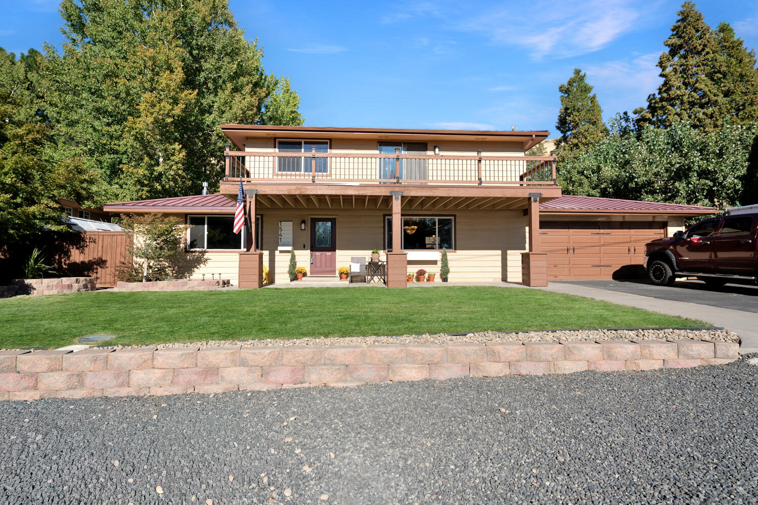 Seller offering $7,500 credit toward closing costs! Welcome to this beautiful home in the highly desirable Moyina Heights neighborhood, offering stunning views of the basin and surrounding mountains. The spacious main-level primary suite features a large bathroom, walk-in closet, and direct access to a concrete patio—ideal for morning coffee or evening relaxation. Upstairs includes two generous bedrooms, a full bath, and a versatile bonus room perfect for a home office, gym, or playroom. The updated kitchen boasts elegant new flooring and a fresh, modern look. Enjoy the peaceful backyard with a large deck, great for entertaining, outdoor dining, or simply unwinding. With its beautiful views, functional layout, and sought-after location, this home is a must-see. Don't miss your chance to make it yours—schedule your showing today!