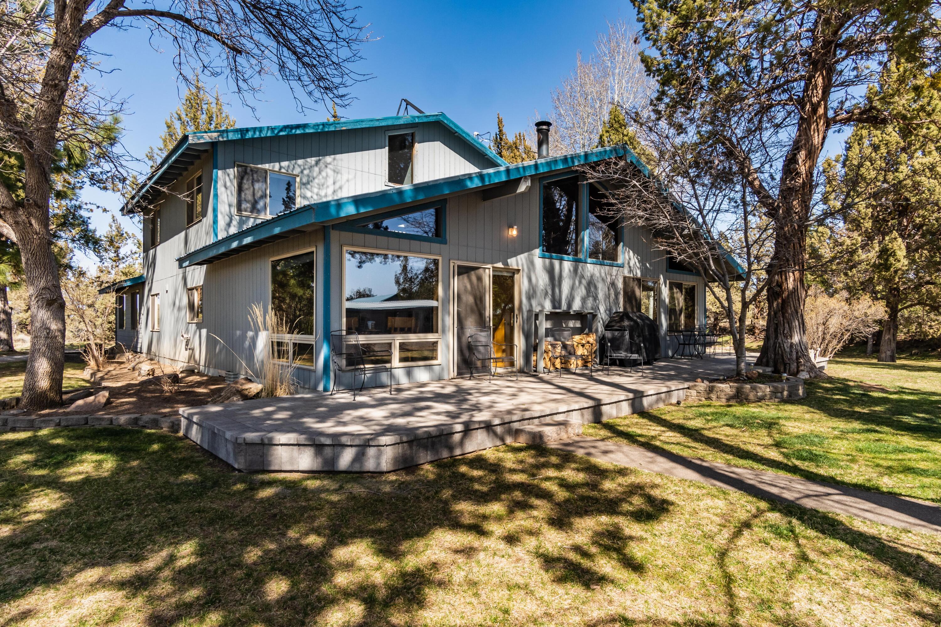 PRIVACY, SECLUSION and HUGE VIEWS with Swalley irrigation.  34 acres with 3400sf, 4BR 2.5BA home overlooking gorgeous pond, irrigated pasture and knockout views of the Cascades.  1990 remodel. Outbuildings include large, high-end shop and office spaces, newer detached 1BR/1BA apartment, 2100sf hay barn (w/3 14x14 stalls and tack room), storage building with more shop space and kennel set-up.  Four bedroom home has nice kitchen open to vaulted living area, two bedrooms & spacious family room on the main level.  Upstairs offers two more bedrooms and nice loft area with office/homework station.    Perfect situation for entertaining in or outdoors; an additional outbuilding is designed with food prep in mind - with walk-in cooler, laundry and large covered patio for covered serving, seating or dancing!