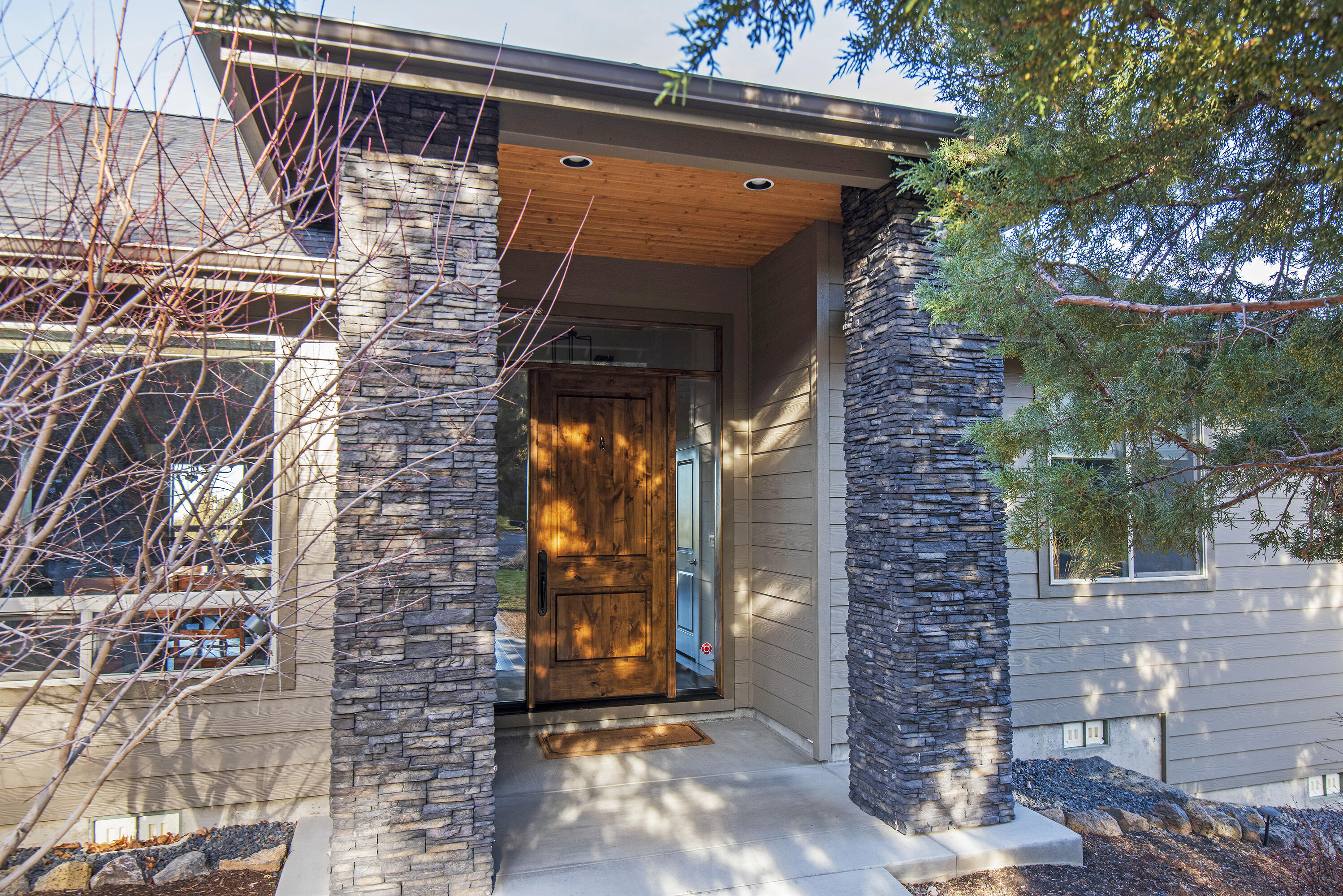 Step through the stunning 8 foot high custom front door and you'll immediately fall in love with this spacious home that combines Northwest charm, comforable family living and endless possibilities for entertaining indoors and out.  The expansive great room, with large deck and panoramic views of Smith Rock as its backdrop, features vaulted and beamed ceilings with massive skylights, troweled walls, and gorgeous hardwood floors.  The gourmet kitchen offers quartz countertops, under-cabinet lighting and high-end appliances to delight any cook.  A two-sided stone fireplane in the family room connects to a bonus room that welcomes family and friends for game nights and media madness.  The bonus room and two bedrooms are located to oneside of the great room with the master suite and and office or fourth bedroom on the other.  Attention to detail and casual sopistication make this incredible property a place you'll want to call home.