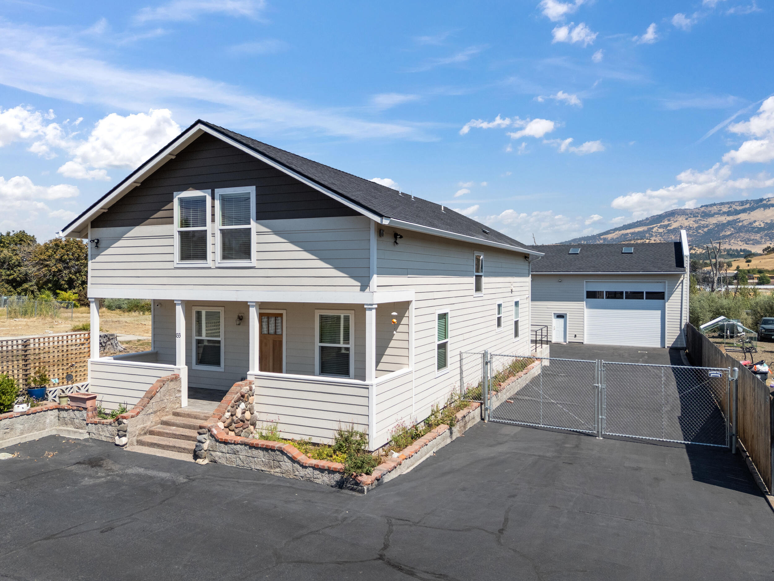 Unique opportunity to own a property on the main drag in a revitalized Phoenix Oregon. Residential home with a shop or utilize it as an office! This property is a 2,346 square foot home that has three
bedrooms, two baths. The property includes a 2,000 square foot shop with two 14 foot roll up doors, 20 foot ceilings.	Zoned City Center, Phoenix, this property offers a lot of flexibility.	Residential or commercial! Work live house or utilize as an office. Gated with an asphalt driveway and parking
leading to the shop. In back of the shop is an expansive garden.