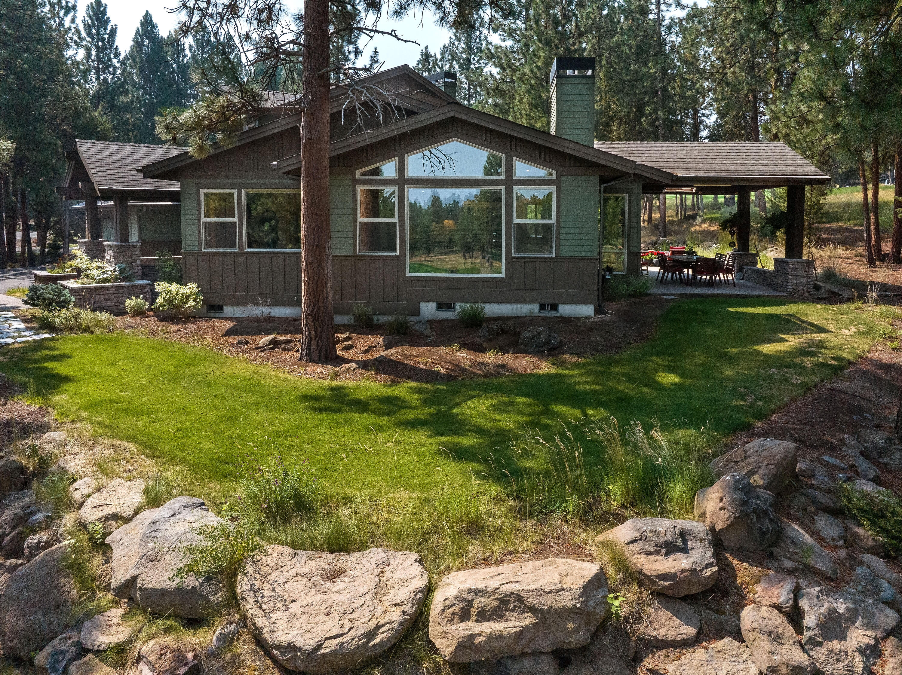 Situated on one of the most private lots in the exclusive gated Awbrey Glen Golf Community, this exquisitely positioned homesite sits nestled amongst mature Ponderosa pines overlooking the 4th green. Inside, every detail has been carefully curated to ensure the utmost comfort and style, including high-end appliances, custom lighting, wood floors, and more.This home offers a large master bed on the main with a spacious walk-in closet, two guest beds with a jack/jill bath upstairs, office space, and a 3-car garage. Whether you're entertaining guests by the built-in gas firepit or enjoying a quiet moment on the expansive outdoor patio, the seamless flow of indoor-outdoor living invites you to savor every moment of Bend living.AG residents have the opportunity to enjoy a world-class, 18-hole course and a private members club, including the NINETEEN restaurant, fitness center, and pool. This home is conveniently located near downtown, trails, and all the local activities Bend has to offer.
