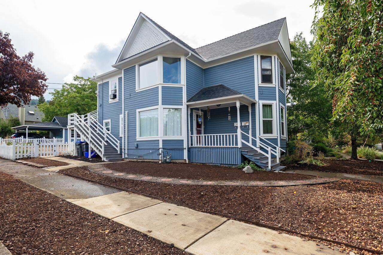 Motivated seller! Situated on a corner lot just minutes from downtown Ashland and SOU, this tastefully updated Victorian home offers two distinct living spaces and exceptional flexibility. The 1,024 sqft main level unit features , 3 bedrooms and 1 bathroom. Highlights include high ceilings, a remodeled kitchen and bathroom, luxury plank flooring, marble floors in the bathroom and laundry room, new windows, updated copper plumbing and electrical systems, and energy-efficient ductless heating and air conditioning.  The 988 sqft upper-level unit offers 2 bedrooms and 1 bathroom. It includes a spacious living room with a gas heater, new luxury plank flooring in the kitchen, and bathroom. The large backyard provides space for gardening. A small shop offers additional storage or space for your creative projects. Live in one unit and rent the other, or lease both for income potential.