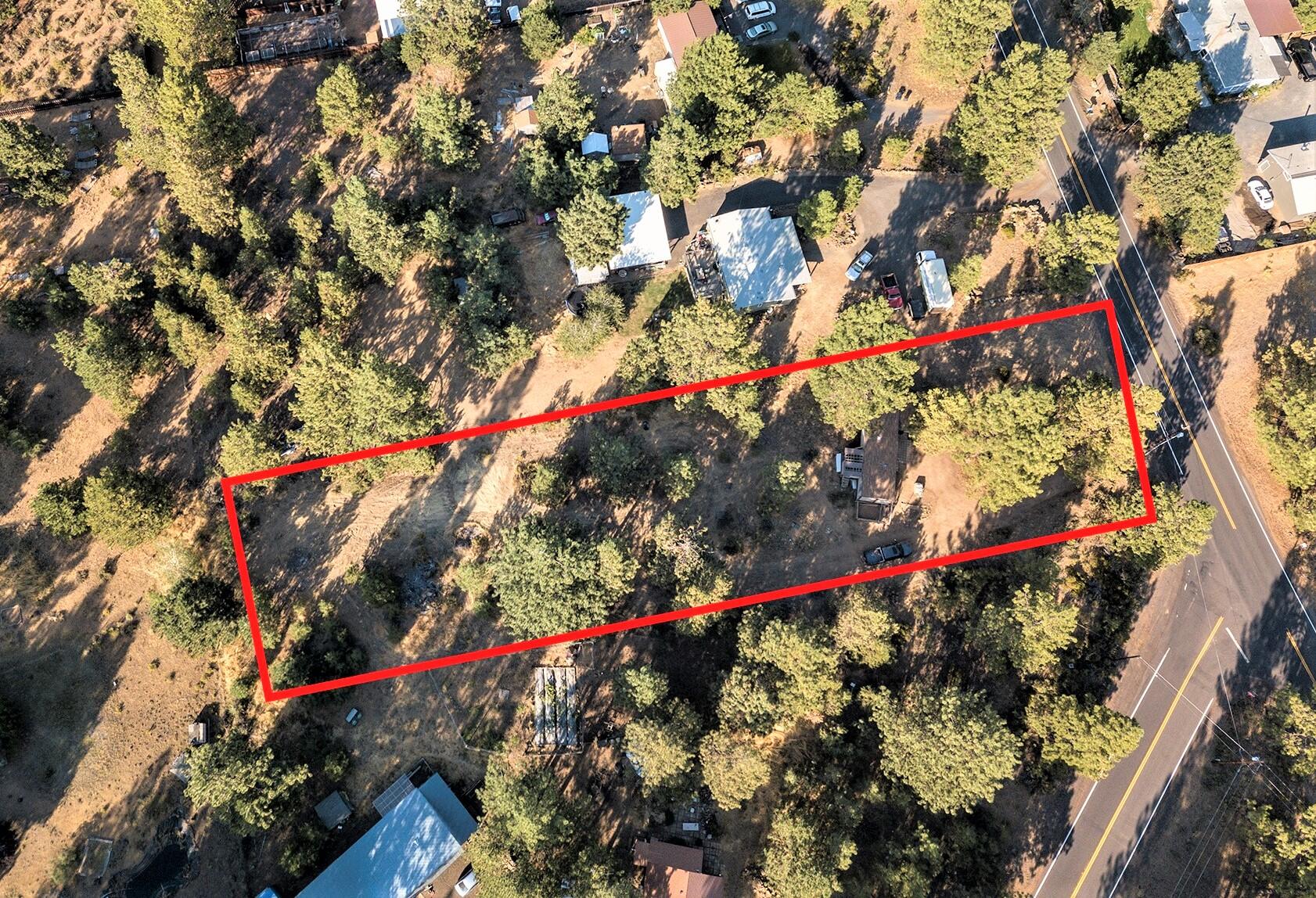 Beautiful, peaceful .84 acre parcel of treed land in Deschutes River Woods.  Remove the older manufactured home (not de-titled) and build your dream home!  Utilities in place on the property including a 1,000 gallon concrete septic tank.  There is also plenty of room for a shop, garden, and/or pets.  Or, use your handyman skills to renovate the twice-moved manufactured home to create a cozy place to live.  Home is currently in rough shape.  The value of this property is in the land.  Seller makes no guarantees as to the condition of the manufactured home or appliances.  No HOA.  Buyer(s) to do their due diligence.  Sold AS-IS.  So much potential to make this property your own!  Come check it out!