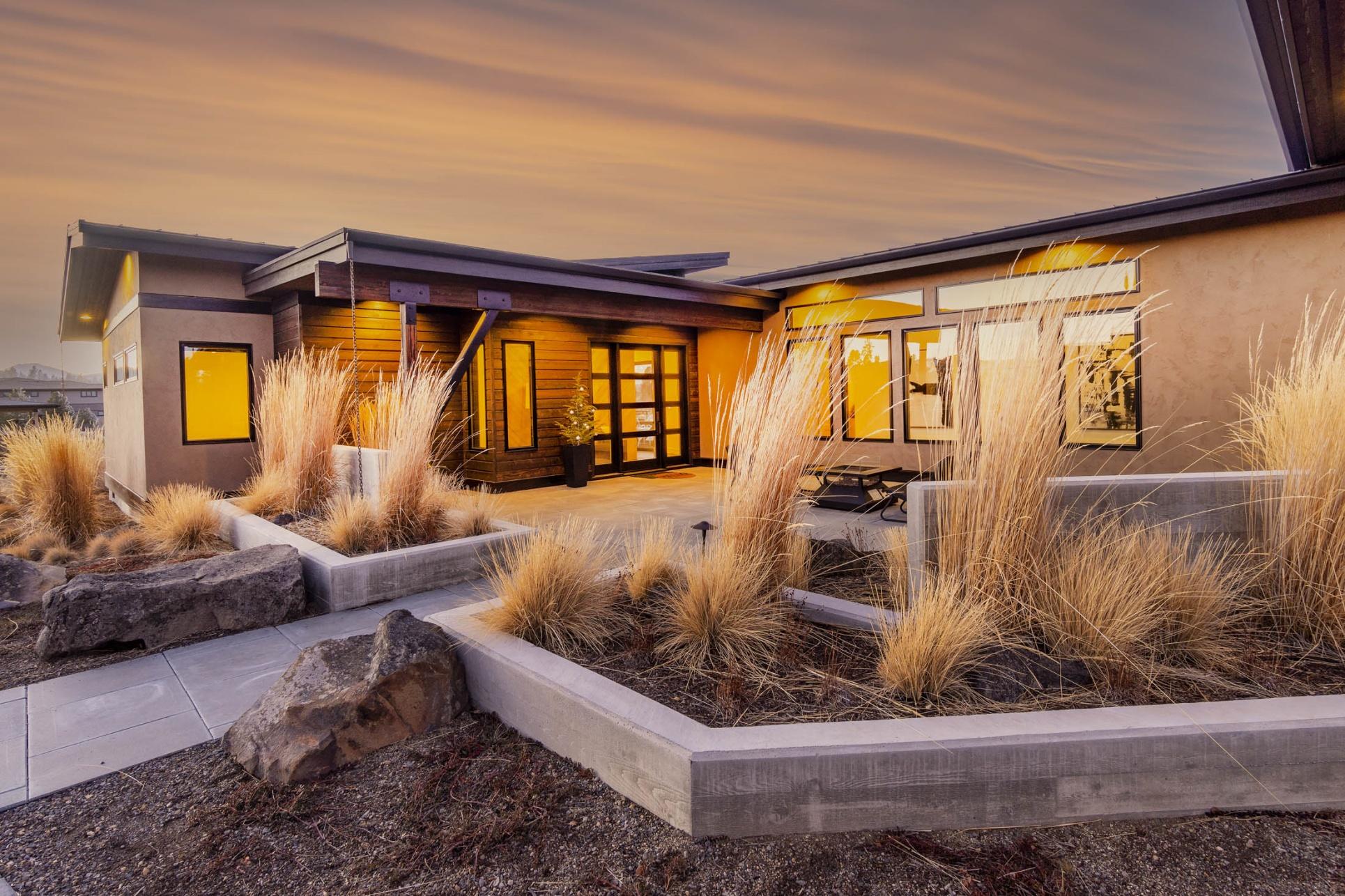 Take in the Cascade Range from this incredible contemporary home in Tetherow. Thoughtfully designed and built by Sunforest Construction, not a single detail was overlooked in this single-level stunner. The chef's kitchen features a large island w/ thick quartz slab countertops & seating for 4. The 48-inch Wolf range makes whipping up gourmet meals a breeze as you and your guests enjoy panoramic Cascade views. Open sliders to the expansive deck, where the incredible views can be enjoyed year-round, thanks to built-in deck heaters and a custom firepit. Enjoy local Bend brews from the double-tap kegerator in the den, which boasts a pvt patio w/ firepit, as well as a closet, should you need another bedroom. Retire to your well-appointed owner's retreat, featuring more mountain views, doors to the deck, and a luxurious walk-in shower w/ 7 shower heads for a true spa-like experience. At the back of the home, find two guest BDs, including a king-sized BD w/ mtn views from its own patio.