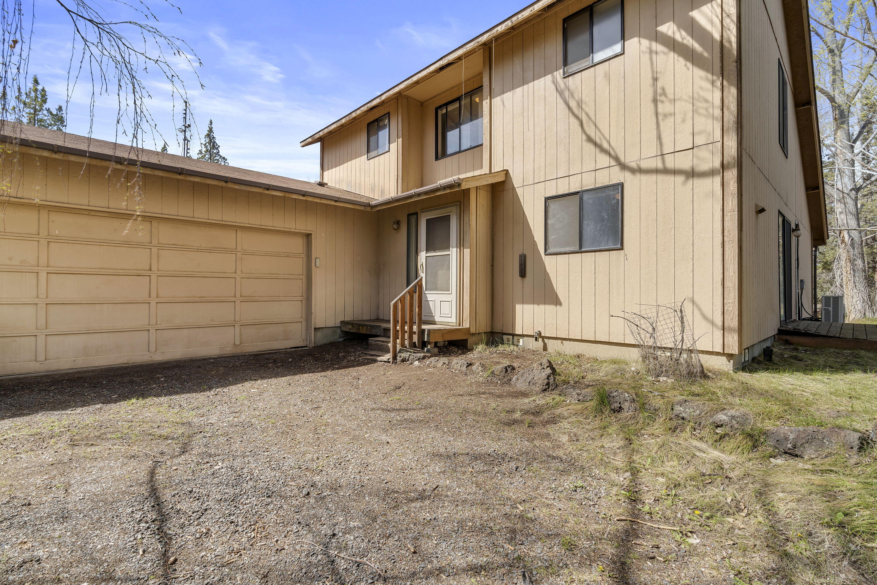 Explore the tranquility of Wayman Acres! This expansive property spans 9 acres, boasting 4.17 acres of irrigated water rights, offering limitless possibilities. The charming stick-built house features vaulted ceilings and a seamless open floor plan. Both bedrooms feature sliding glass doors, perfect for admiring garden views or stepping out for a peaceful morning coffee. Upstairs, discover a spacious bedroom with an accompanying bathroom, walk-in closet, and a loft area overlooking the living room. The generous garage provides ample space, ideal for a workbench or additional storage. Revel in peekaboo mountain views throughout the property. Don't miss out - schedule a visit today!